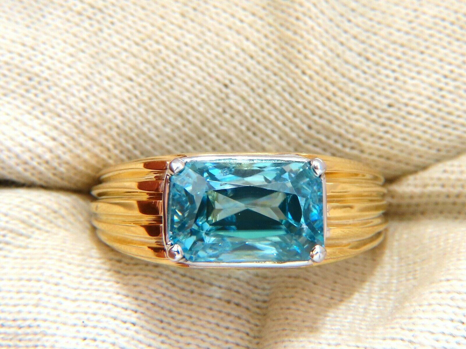 7.43 carat natural blue zircon solitaire ring

Measuring 11.9x7.4 mm

Radiant cut, clean clarity vivid indigo blue

18 karat yellow gold 12.4 g

Depth of ring 7.5 mm

Size 10 and we may resize please inquire.

$6000 appraisal certificate will