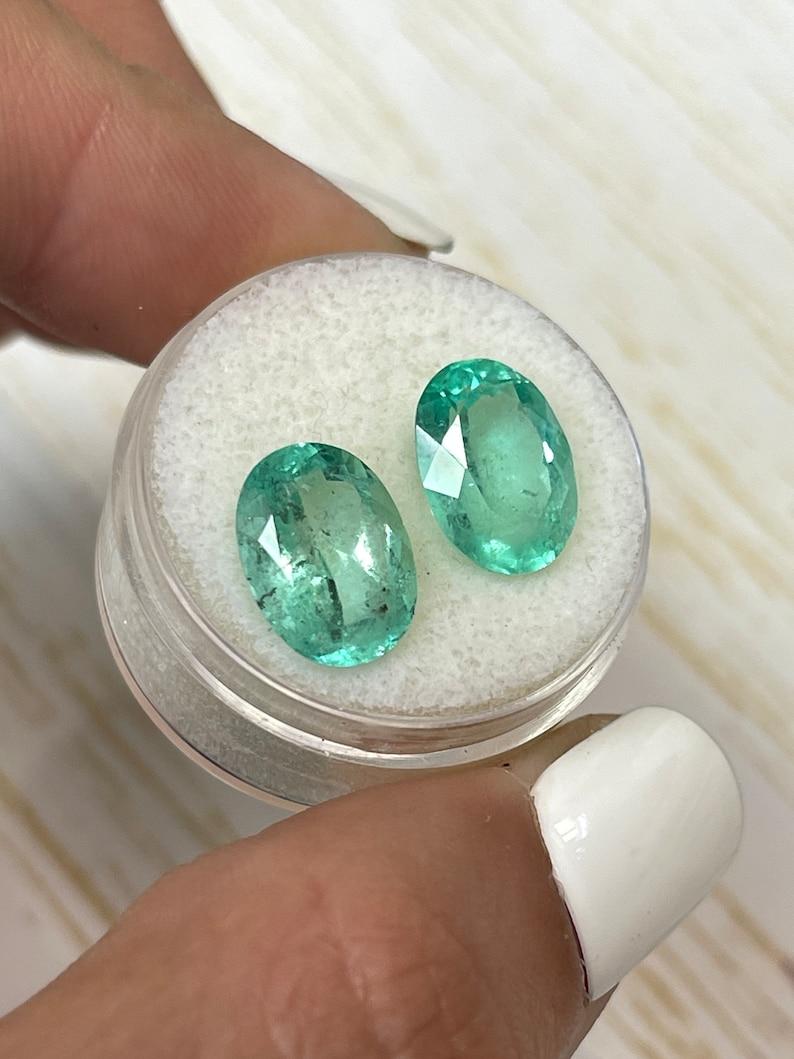 7,43tcw 12x9 smeraldi colombiani sciolti abbinati - gemme genuine dal taglio ovale In condizioni Nuovo in vendita a Jupiter, FL