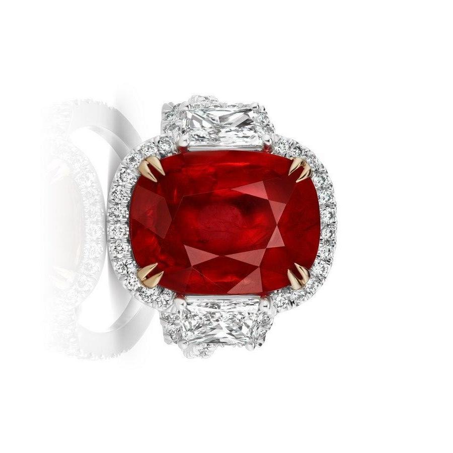 Beautiful Red Ruby with a very slight pink undertone, flanked by Trapezoid shaped Diamonds and surrounded by a halo of pave Diamonds.
Set in Platinum and 18 Karat Yellow Gold.