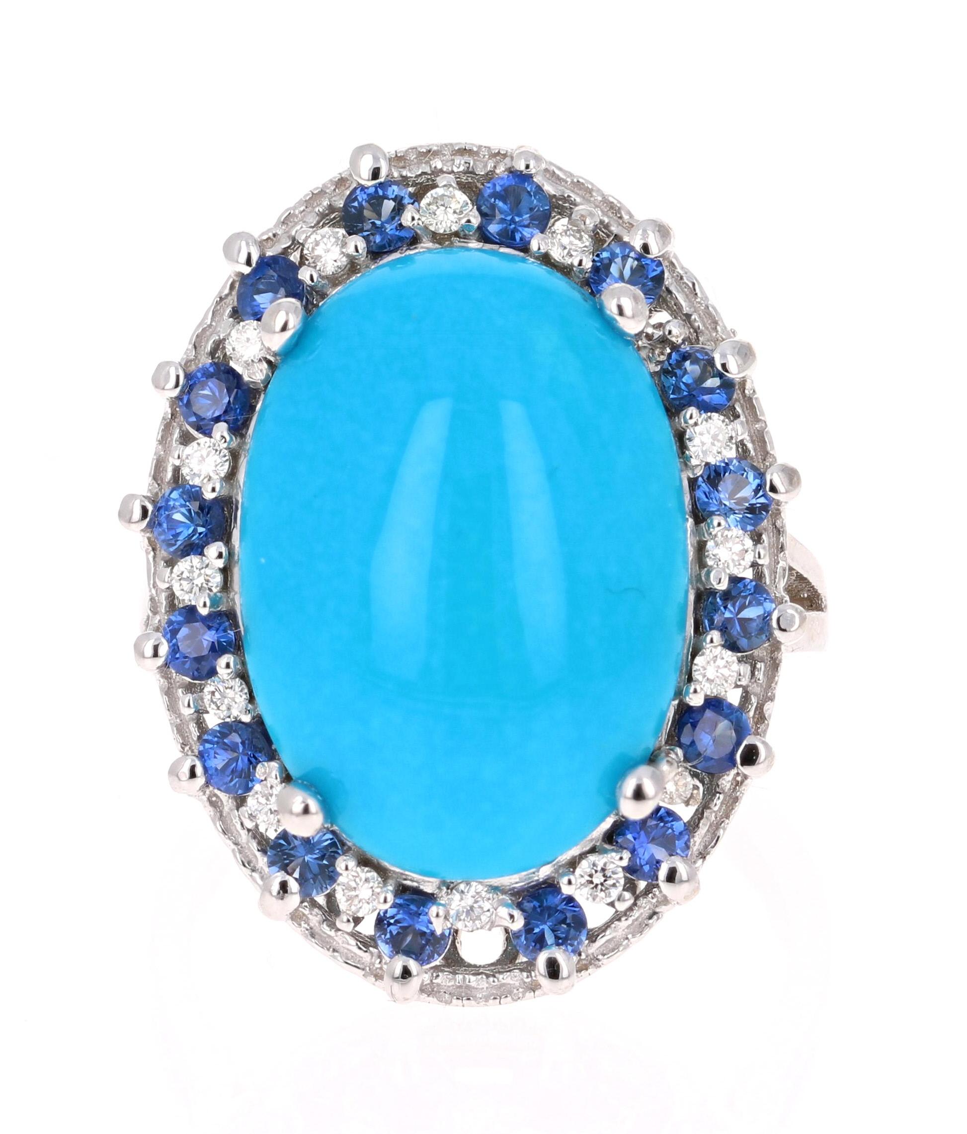 Beautiful Turquoise, Blue Sapphire and Diamond Cocktail Ring!
This ring has an  Oval Cut Cabochon Turquoise that weighs 6.48 Carats and is artistically enhanced with Round Cut Diamonds and Blue Sapphires.  There are 16 Blue Sapphires weighing 0.79