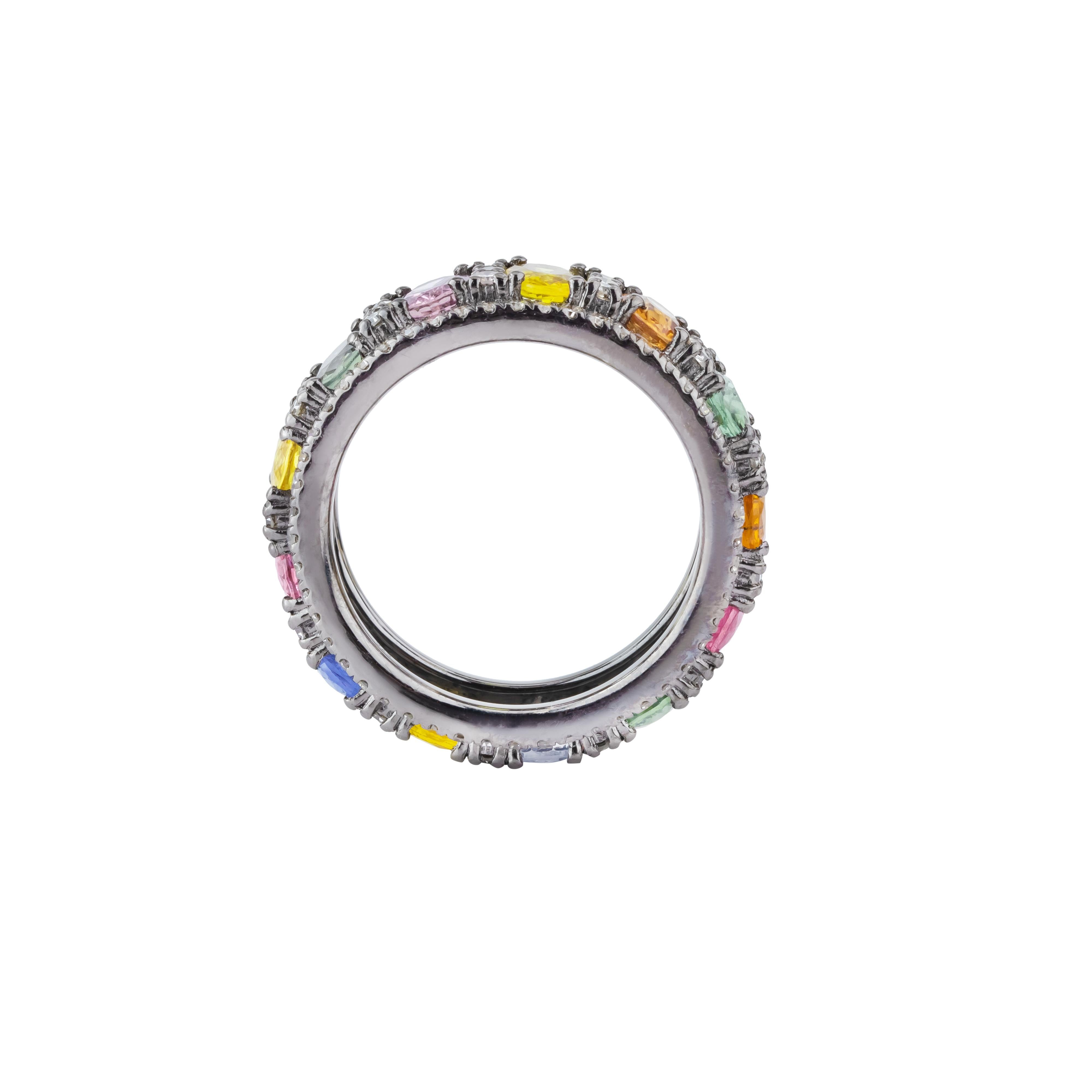The 7.46 Carat Diamond and Multi Sapphire Infinity Band Ring captures the essence of eternal elegance with its seamless design and vibrant gemstone arrangement. This exquisite band showcases a continuous loop of meticulously selected diamonds and
