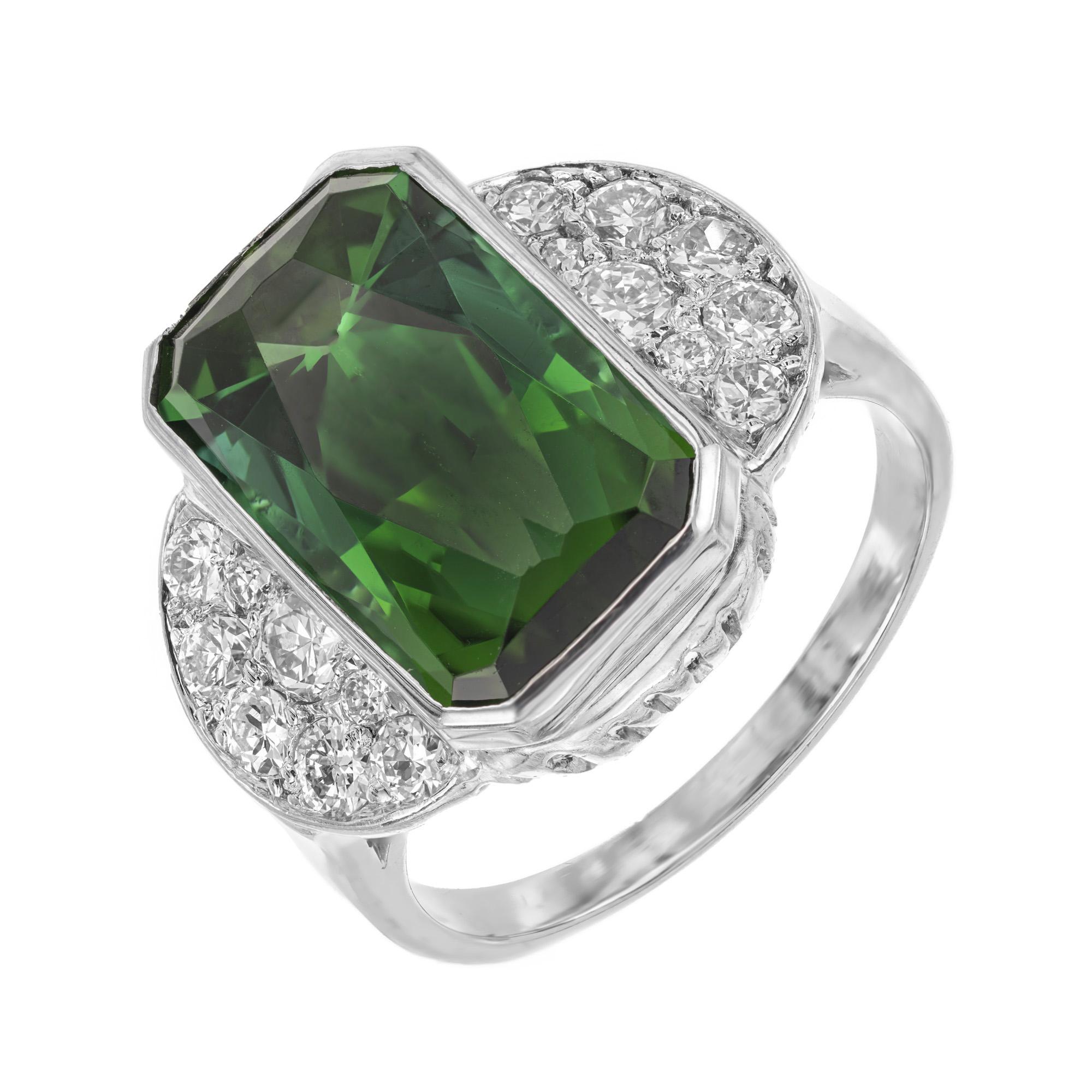 Vintage 1950's octagonal elongated green Tourmaline and diamond ring. Spectacular 7.46 Carat Green Octagonal Tourmaline Gubelin certified as natural Tourmaline. Accented with 16 Pavé set round full cut Diamonds in a platinum cocktail setting. The