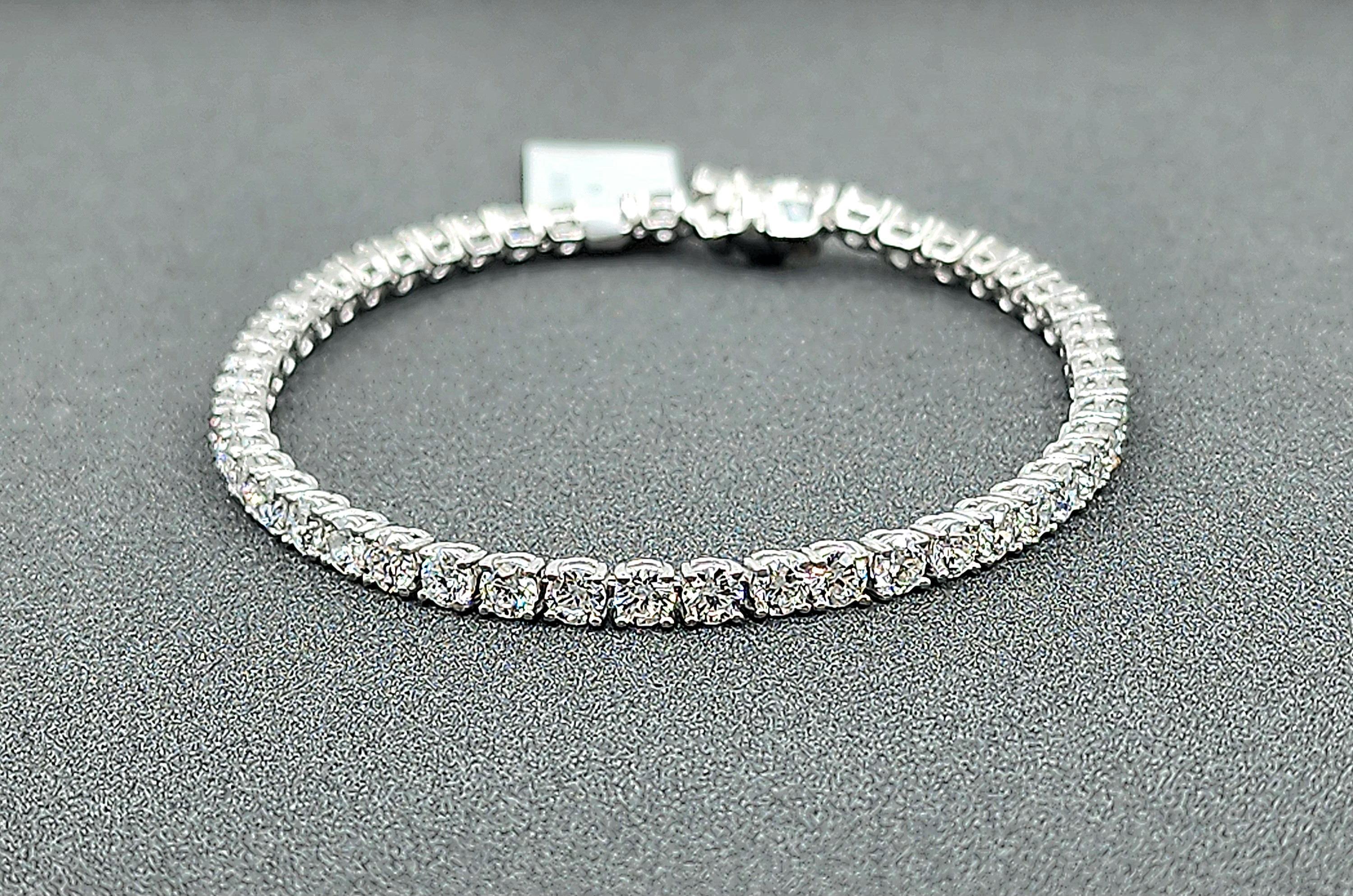This elegant tennis bracelet features 7.46 carats of round white diamonds, each meticulously cut to enhance their brilliance. The diamonds are F/G in color and have a clarity of VS1/VS2, ensuring a dazzling sparkle. Set in platinum, the bracelet