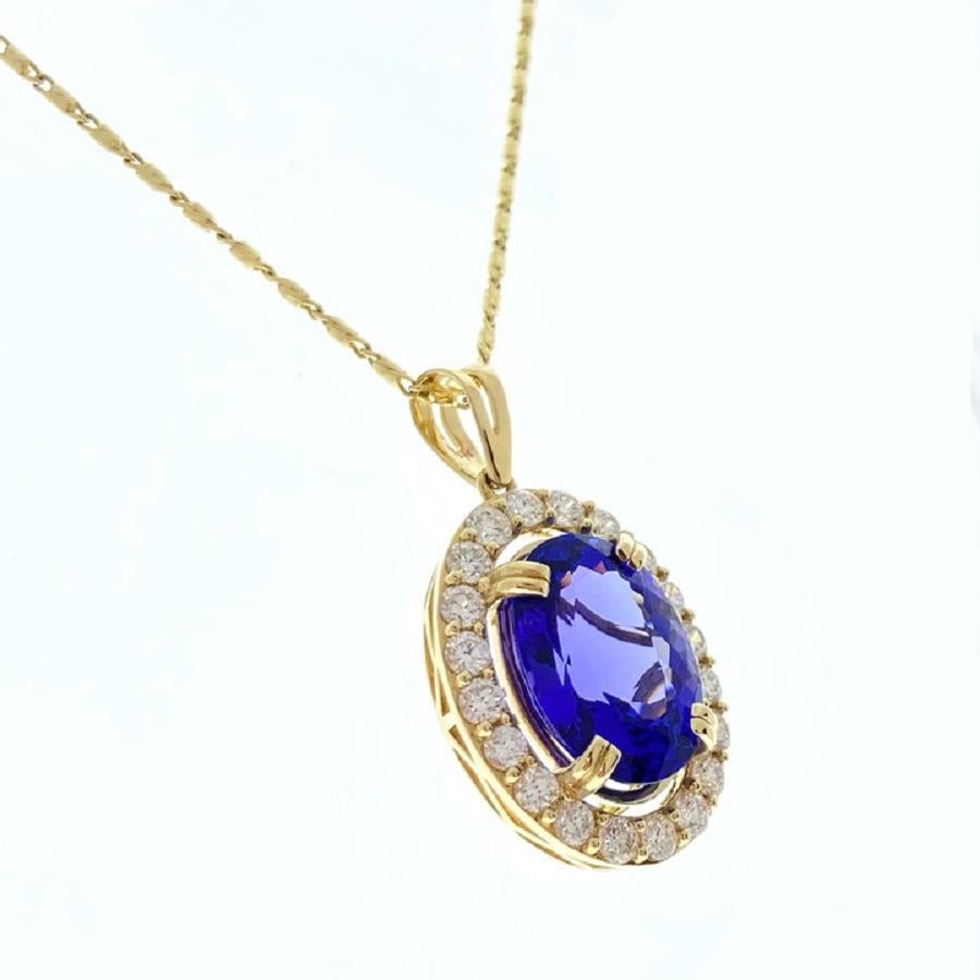 This breathtaking pendant features a stunning 7.47-carat oval bluish-purple tanzanite, renowned for its unique and mesmerizing hue. The tanzanite is elegantly complemented by 20 round diamonds, with a total weight of 1.15 carats, which accentuate