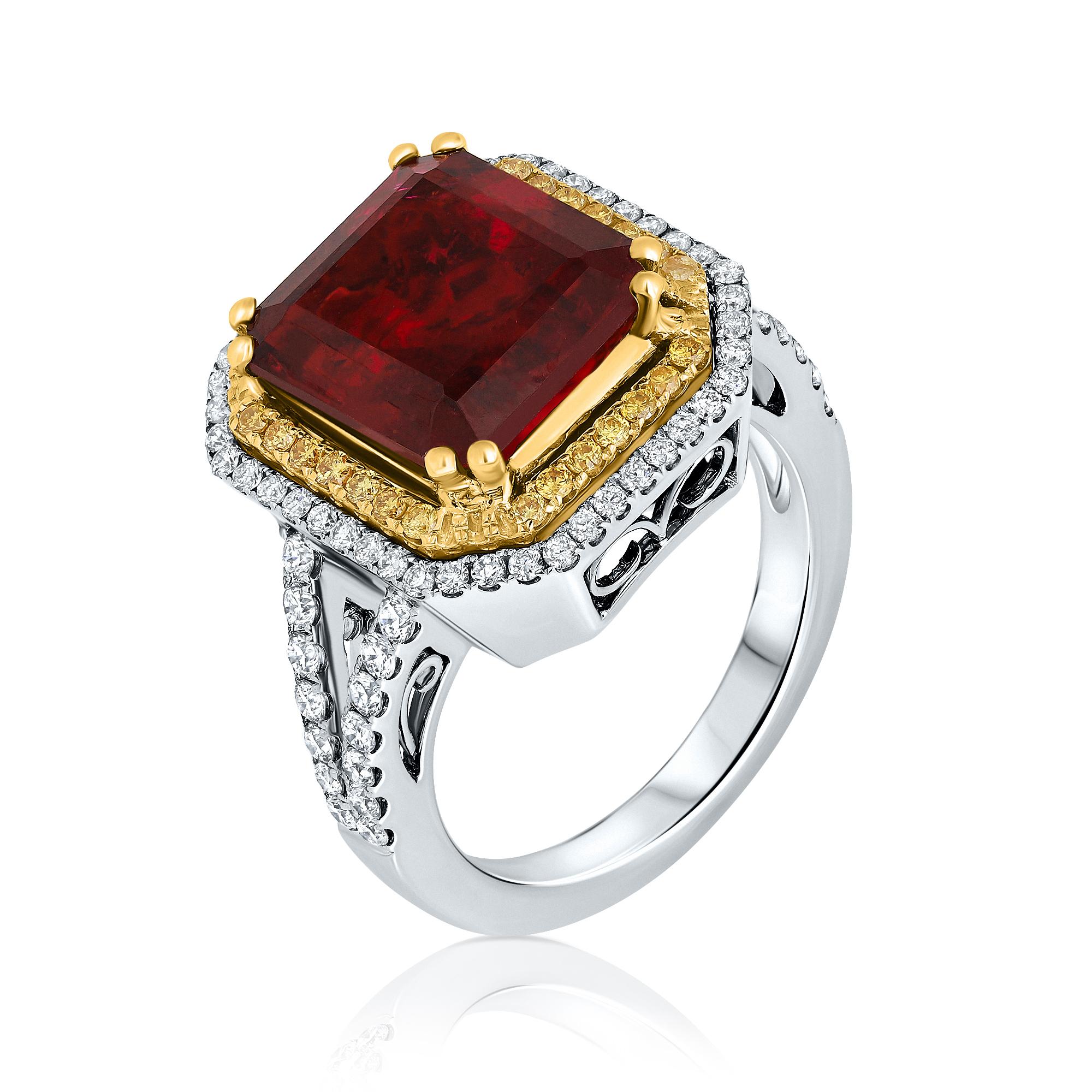 A magnificent 8.90 carat Double Halo ring, featuring 7.47 carat emerald cut Red Tourmaline (Rubellite) set in double halo. This classic design brings out the beauty of the center stone with the surrounding round brilliant yellow diamonds weighing
