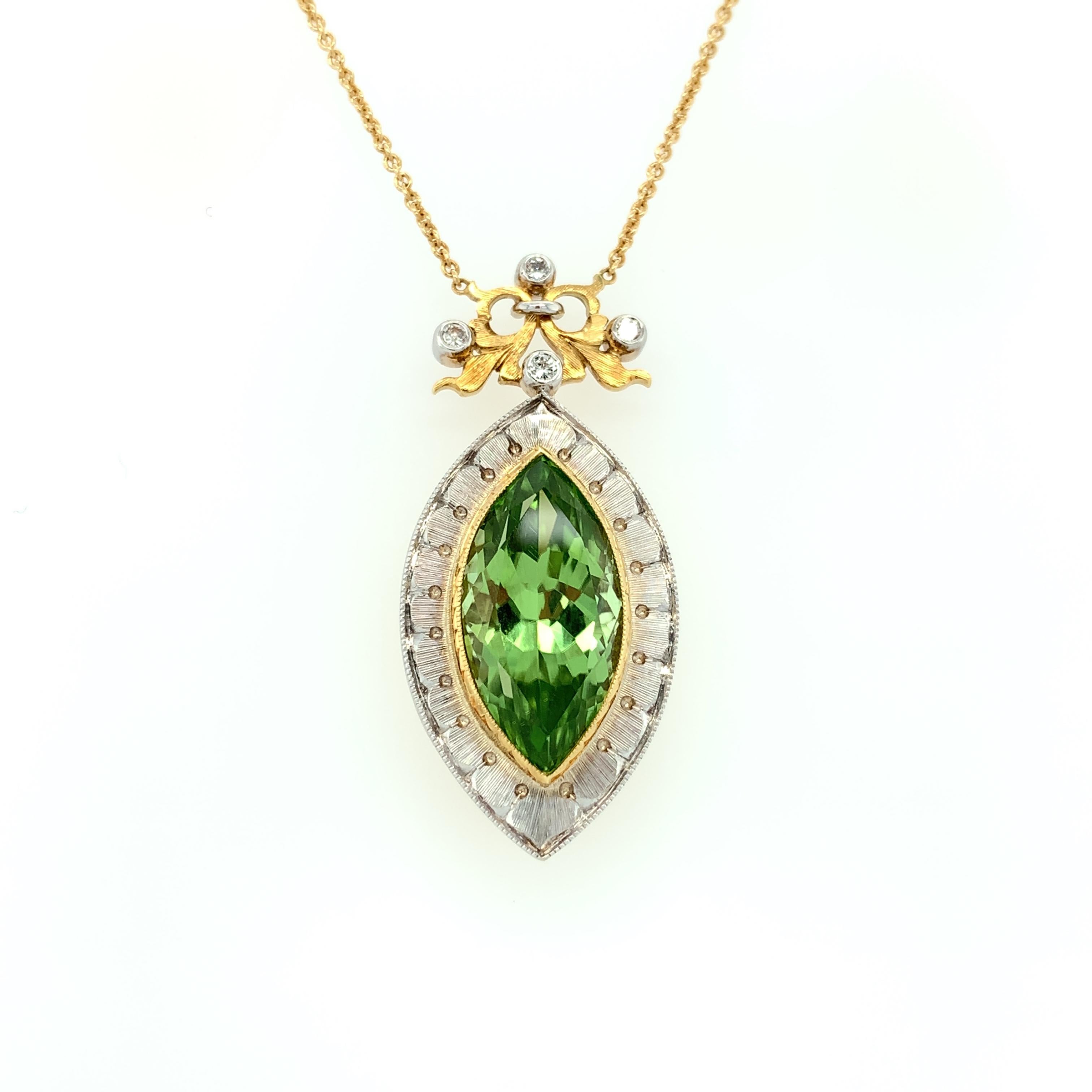 This beautiful, statement features an unusual, marquise shape peridot in a necklace that will never go out of style. The peridot is far less yellowish-green than most peridot; rather, it is a slightly 