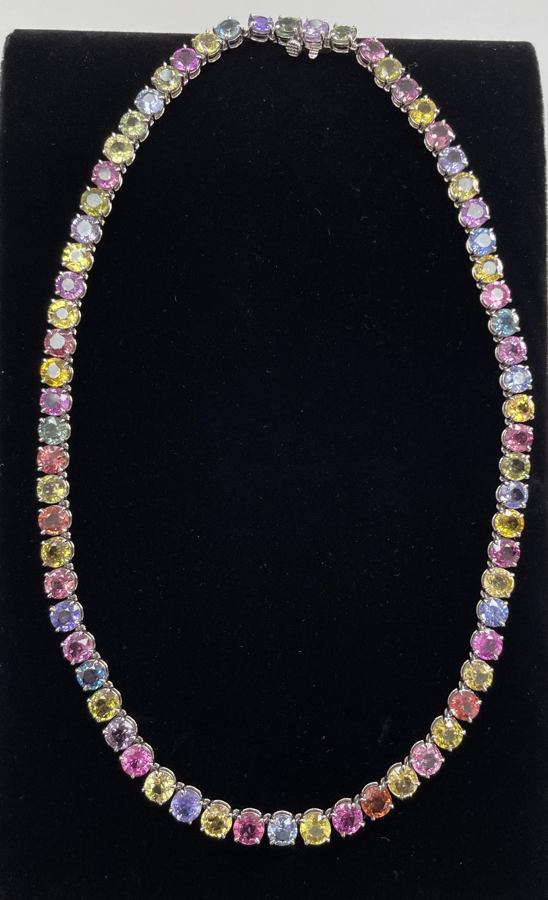 A multi color natural sapphire necklace; sixty-eight 6MM assorted round, pastel-colored sapphires that are none heat treated, weighing 74.87Ct set in 18K white gold. BEAUTIFUL for any occasion!