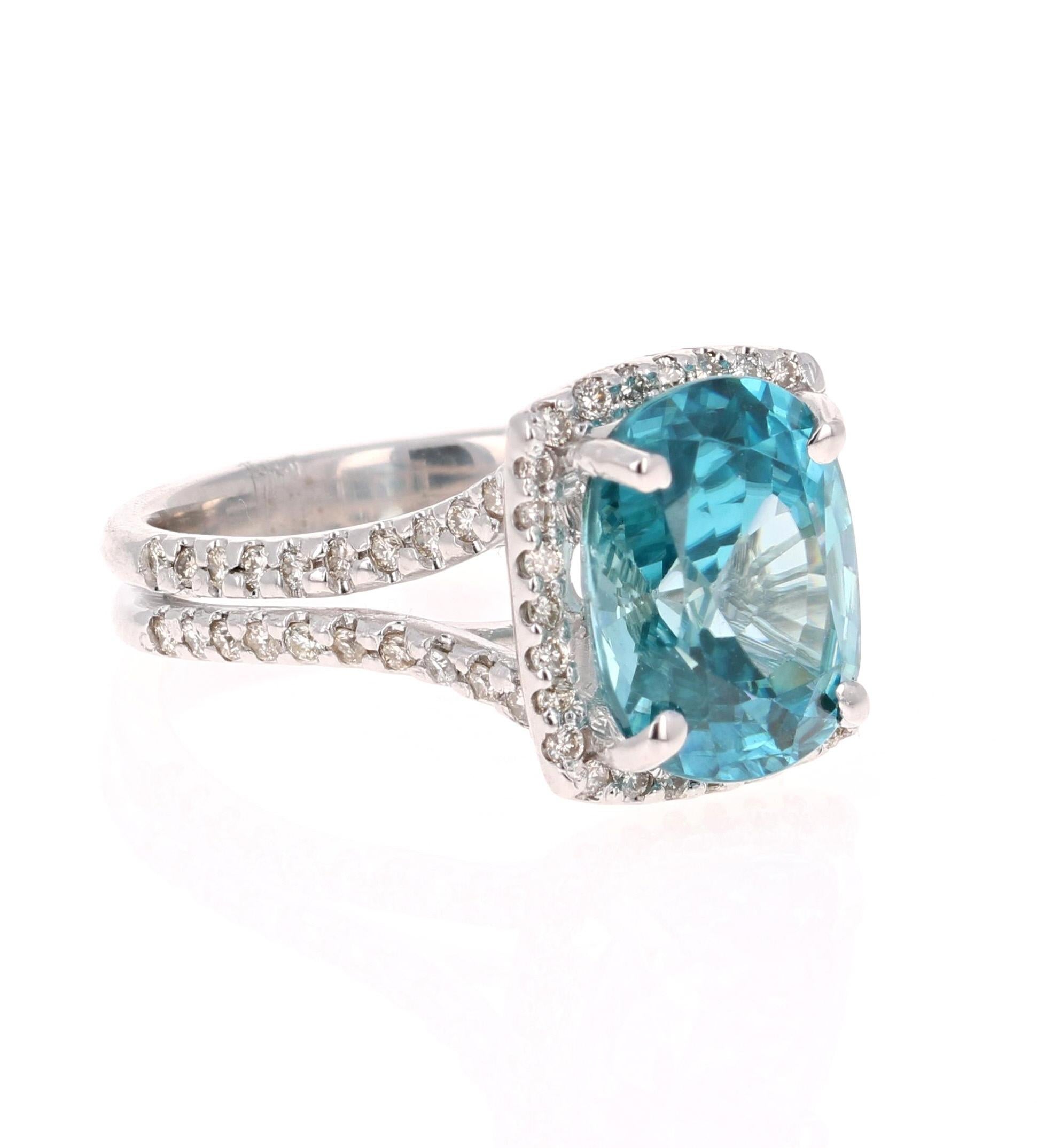 A Dazzling Blue Zircon and Diamond Ring! Blue Zircon is a natural stone mined in different parts of the world, mainly Sri Lanka, Myanmar, and Australia. 

This Oval Cut Blue Zircon is 6.83 Carats and is surrounded by a halo and split shank of 70