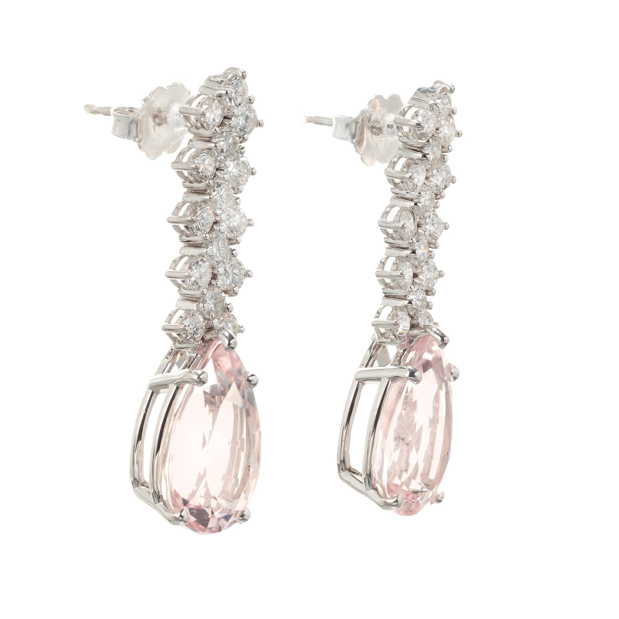 Light pink pear shaped morganite and diamond dangle drop earrings. Fllexible rows of bright white full cut diamonds. Circa 1960

2 pear shape pink morganite, approx. total weight 6.59cts, VS
30 round brilliant cut diamonds, approx. total weight