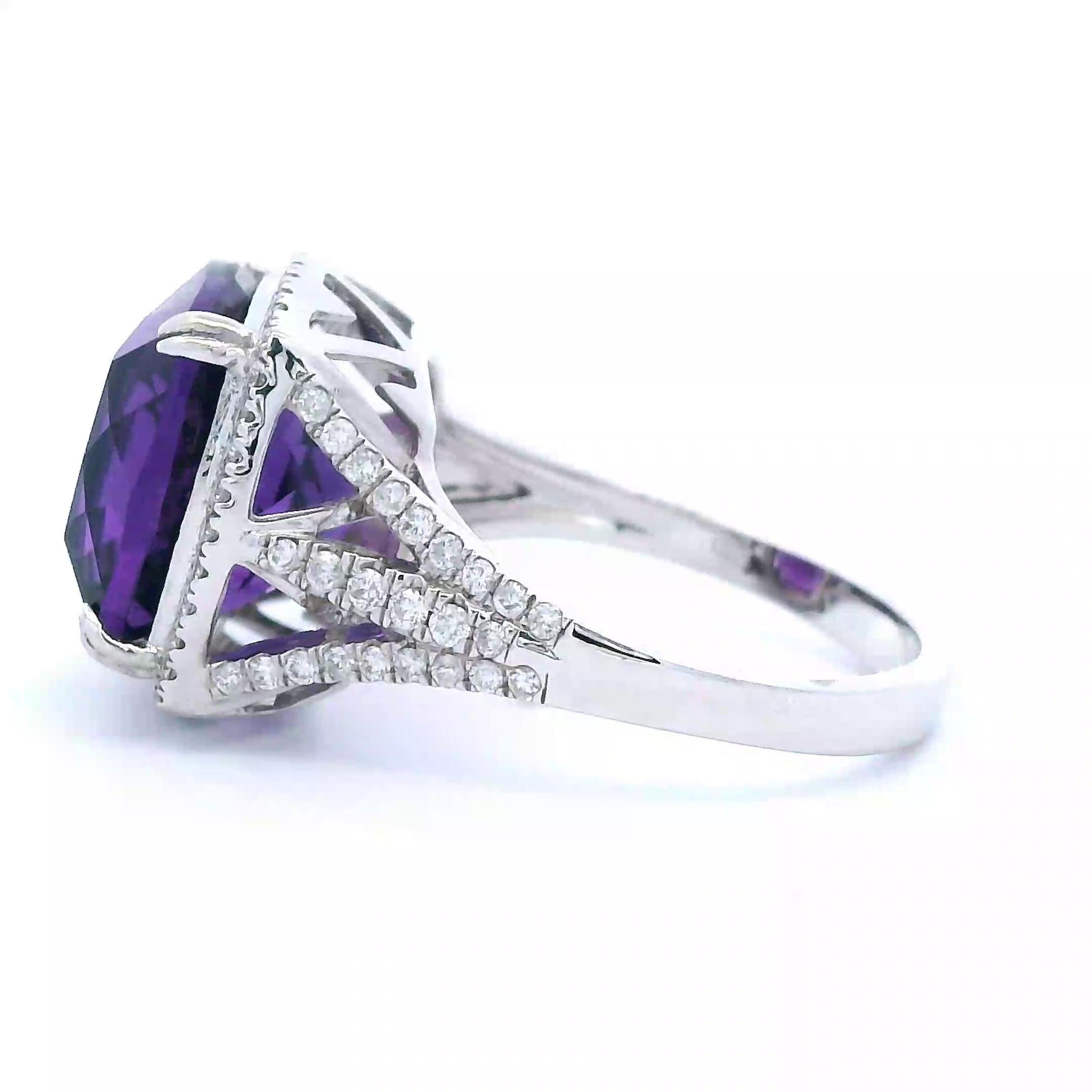 Stunning amethyst and diamond ring.
7.96 carats total gemstone weight.
7.49 carat cushion amethyst. 88 round brilliant diamonds, 0.47 carats. Approximately G color and VS2 clarity. 14-karat white gold, 3.92 grams, ring size 6.50