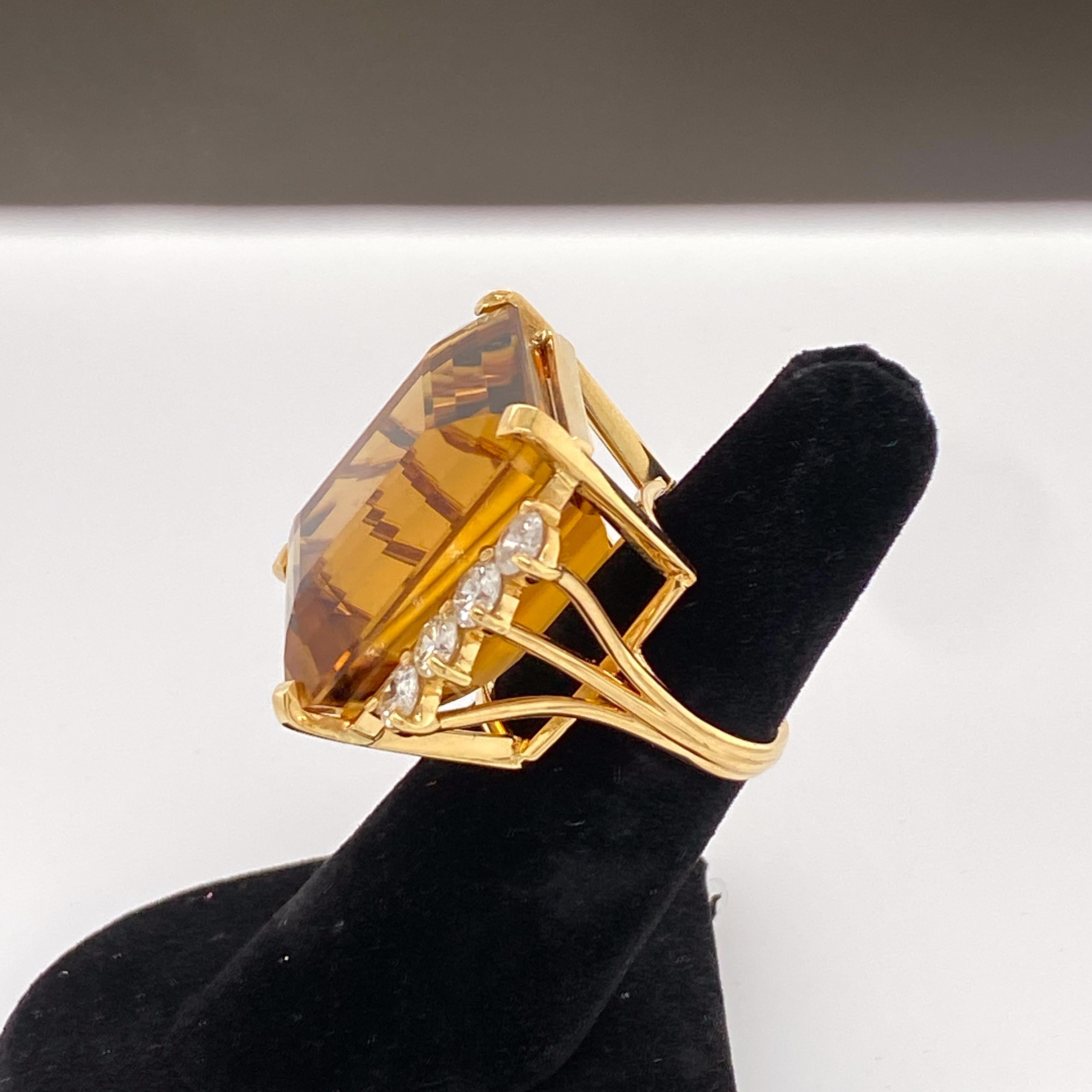 Gorgeous citrine cocktail ring set in 18kt yellow gold with almost 2.5cts for F/G color diamonds on each side accenting the exceptional colored center stone.
SIZE 6.5