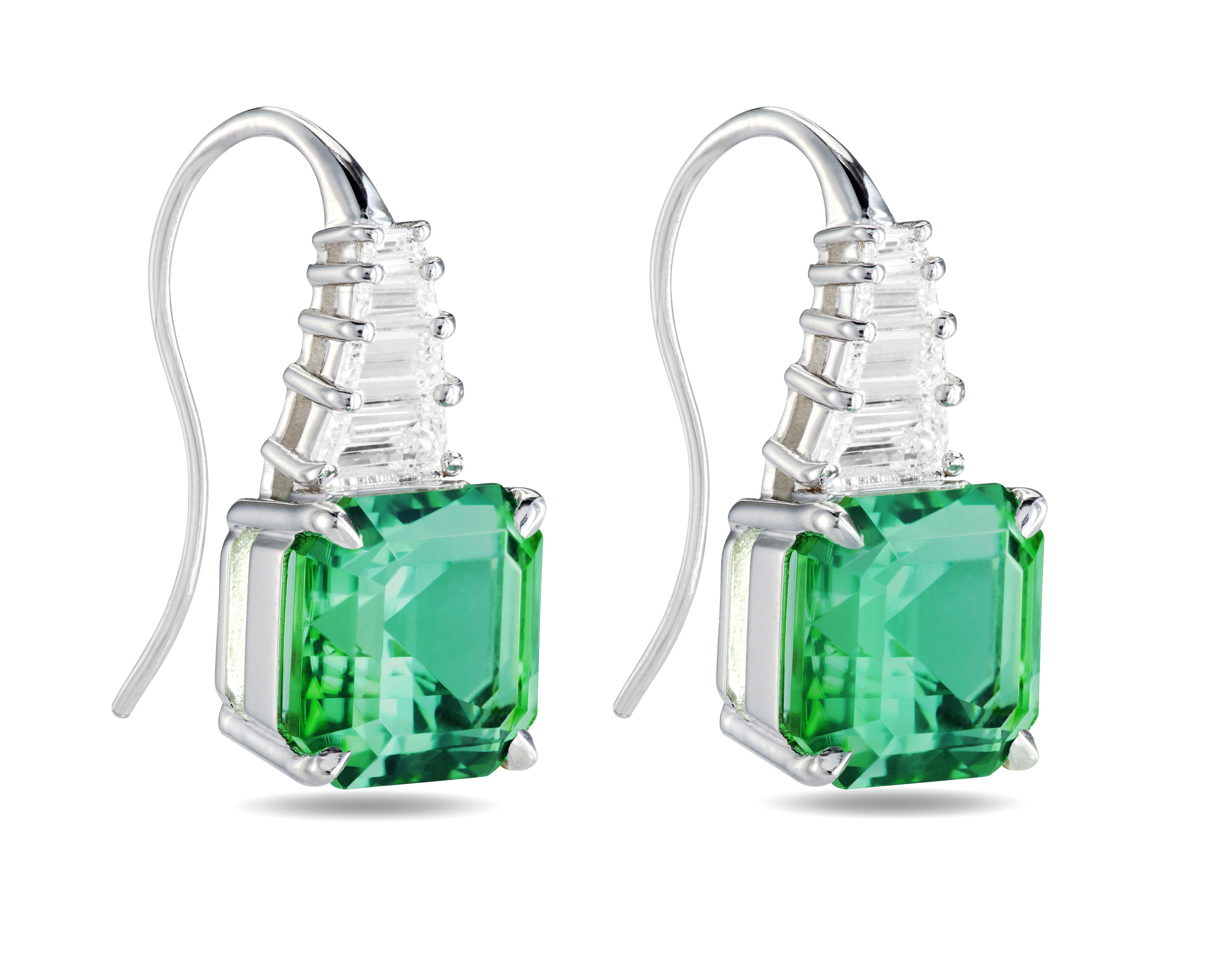 From our One-of-a-Kind collection, each earring is handcrafted in an 18K white gold and set with one 3.2 ct. asscher-cut vibrant mint green Tourmaline and four graduated trapeze-cut colorless diamonds.
Total diamond weight is approximately 0.58