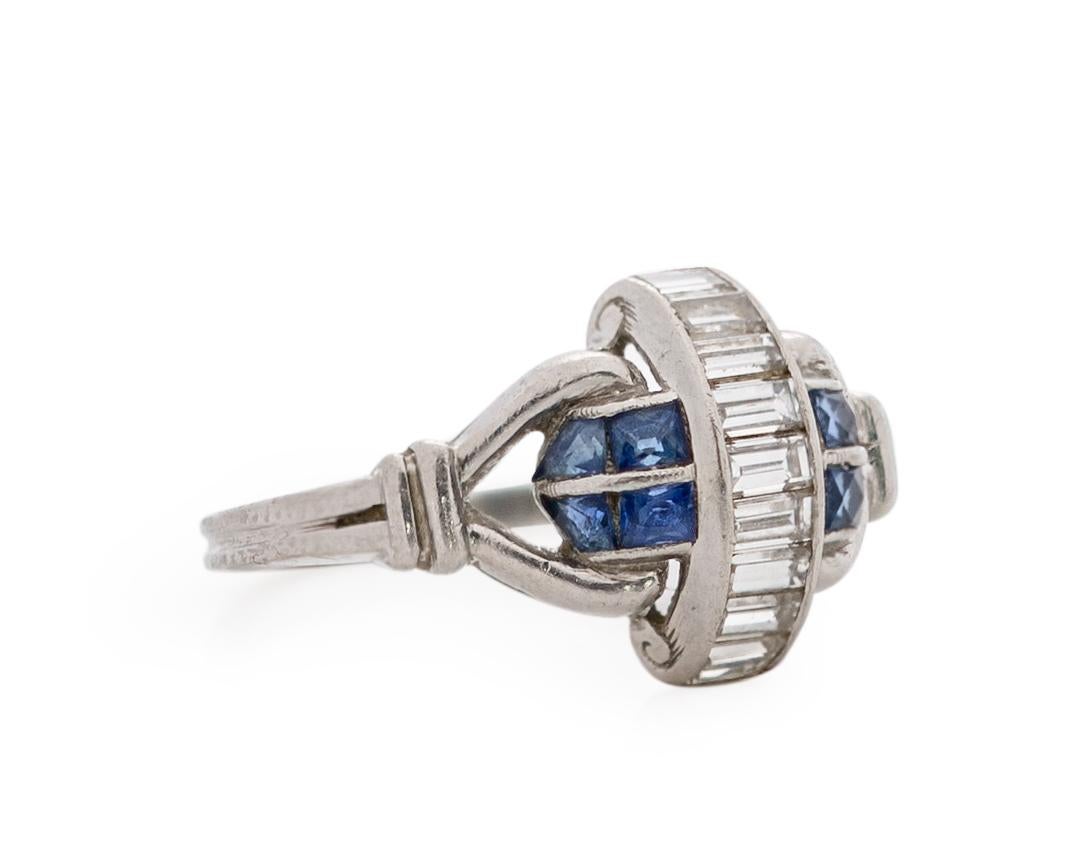 Item Details: 
Ring Size: 4.75
Metal Type: Platinum [Hallmarked, and Tested]
Weight: 3.0 grams

Center Diamond Details:
Weight: .75 Carat
Cut: Antique Step Cut
Color: F
Clarity: VS

Side Stone Details:
Type: Sapphires, Natural
Weight: .30 Carat