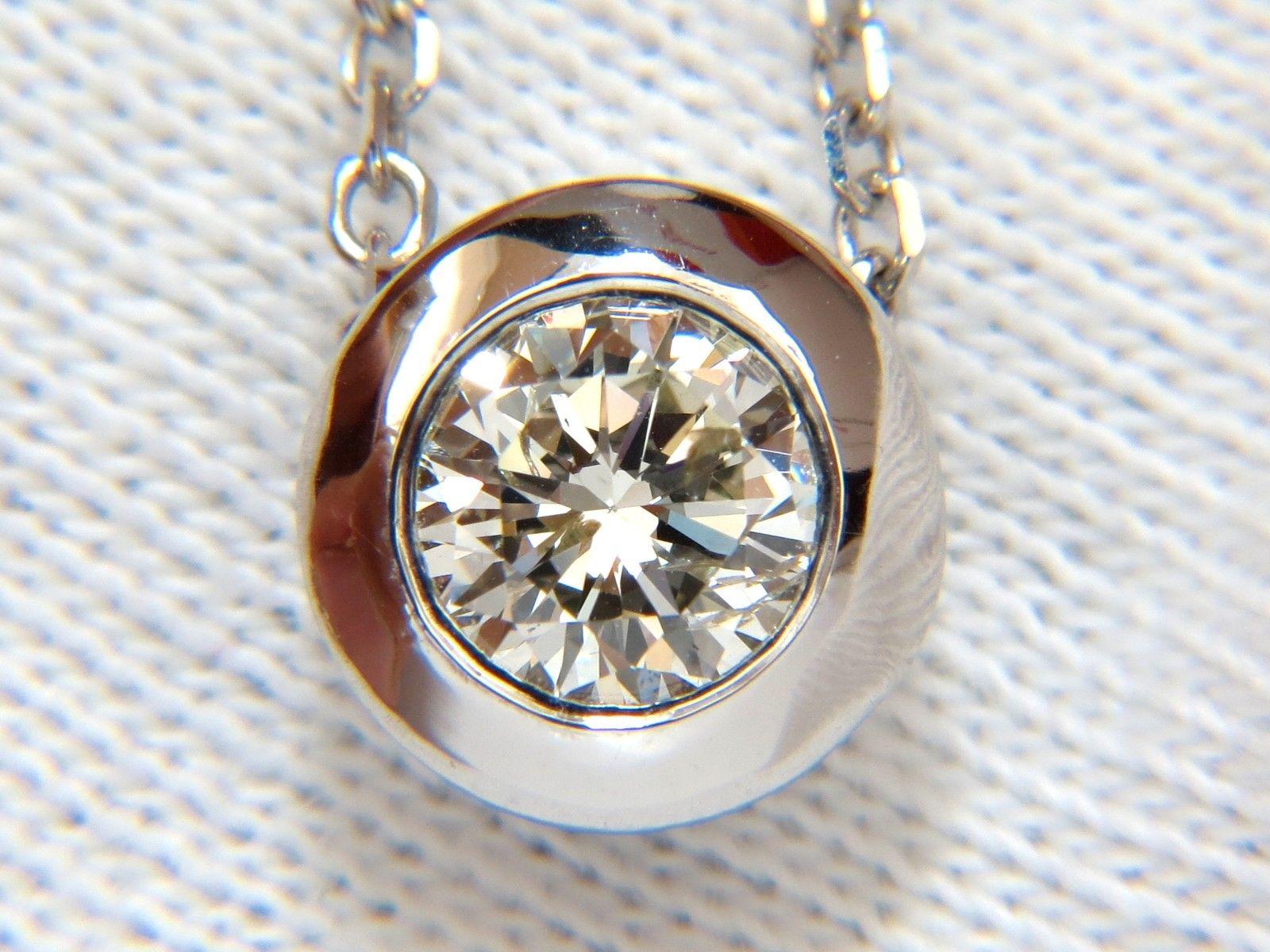 Classic Bezel Solitaire

.75ct. Round diamond

Best Sparkle

Very Good Cut

Si-1 clarity J-color

5.6mm diameter

14kt. white gold

Pendant Measures: 

9.30mm in diameter



14kt 18'' Necklace is included

$5000 appraisal will accompany