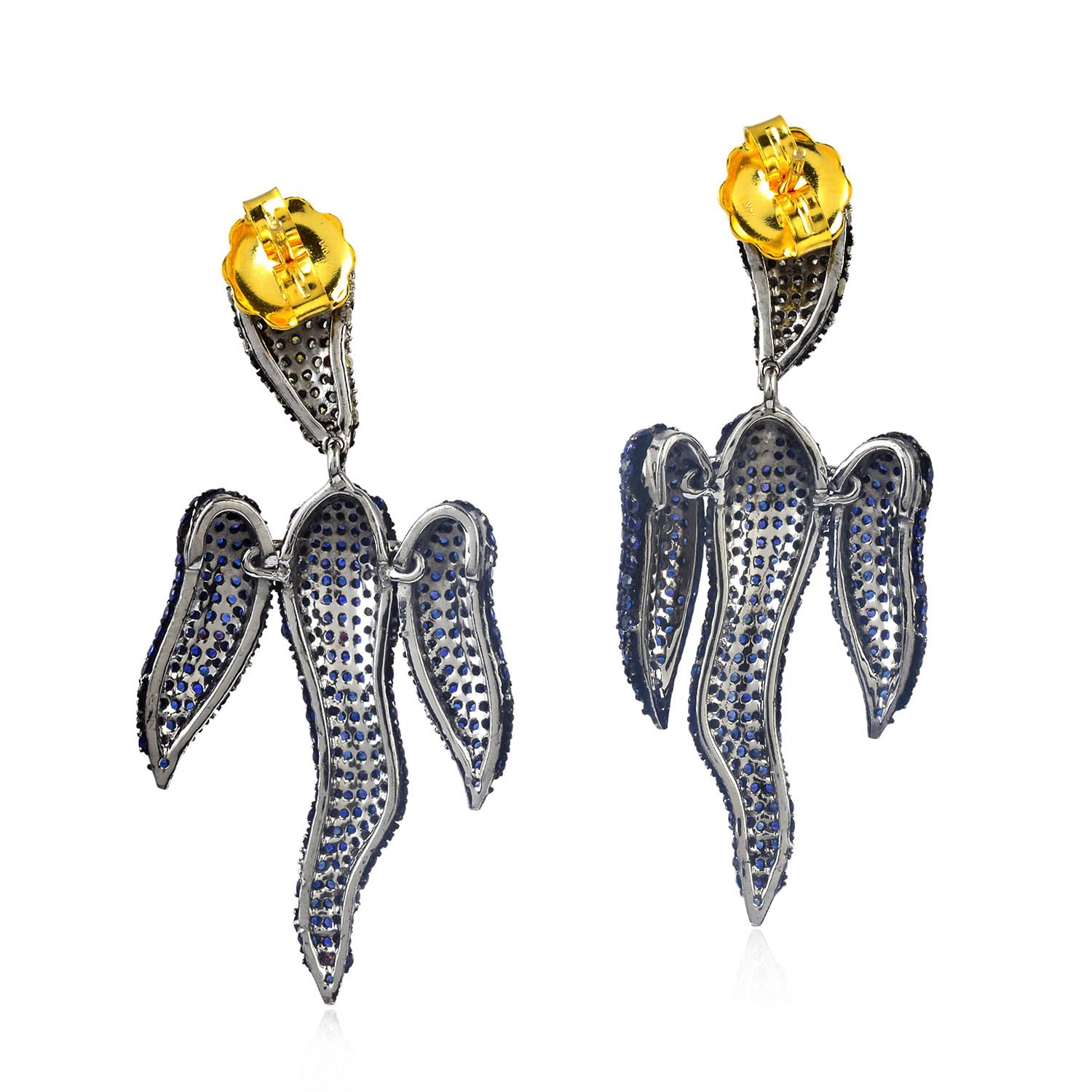 Cast in 14-karat gold & sterling silver, these beautiful drop earrings are set with 7.5 carats blue sapphire and 1.75 carats of sparkling diamonds. 

FOLLOW  MEGHNA JEWELS storefront to view the latest collection & exclusive pieces.  Meghna Jewels
