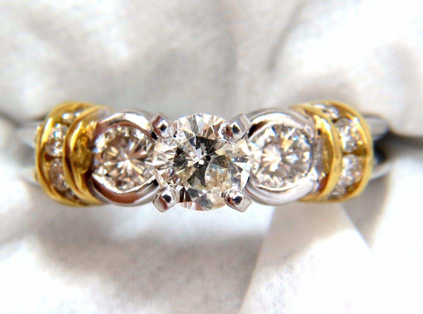 Traditional & Gold Shoulders

.35ct. Center diamond & .40ct. side diamonds ring.

Center diamond: Round & Full cut 
  
I- color & I-1 clarity.

Diameter: 4.7mm

Side Diamonds: I-color, Si-1 clarity.
14kt. gold.

Item: 4.2 Grams

free sizing and