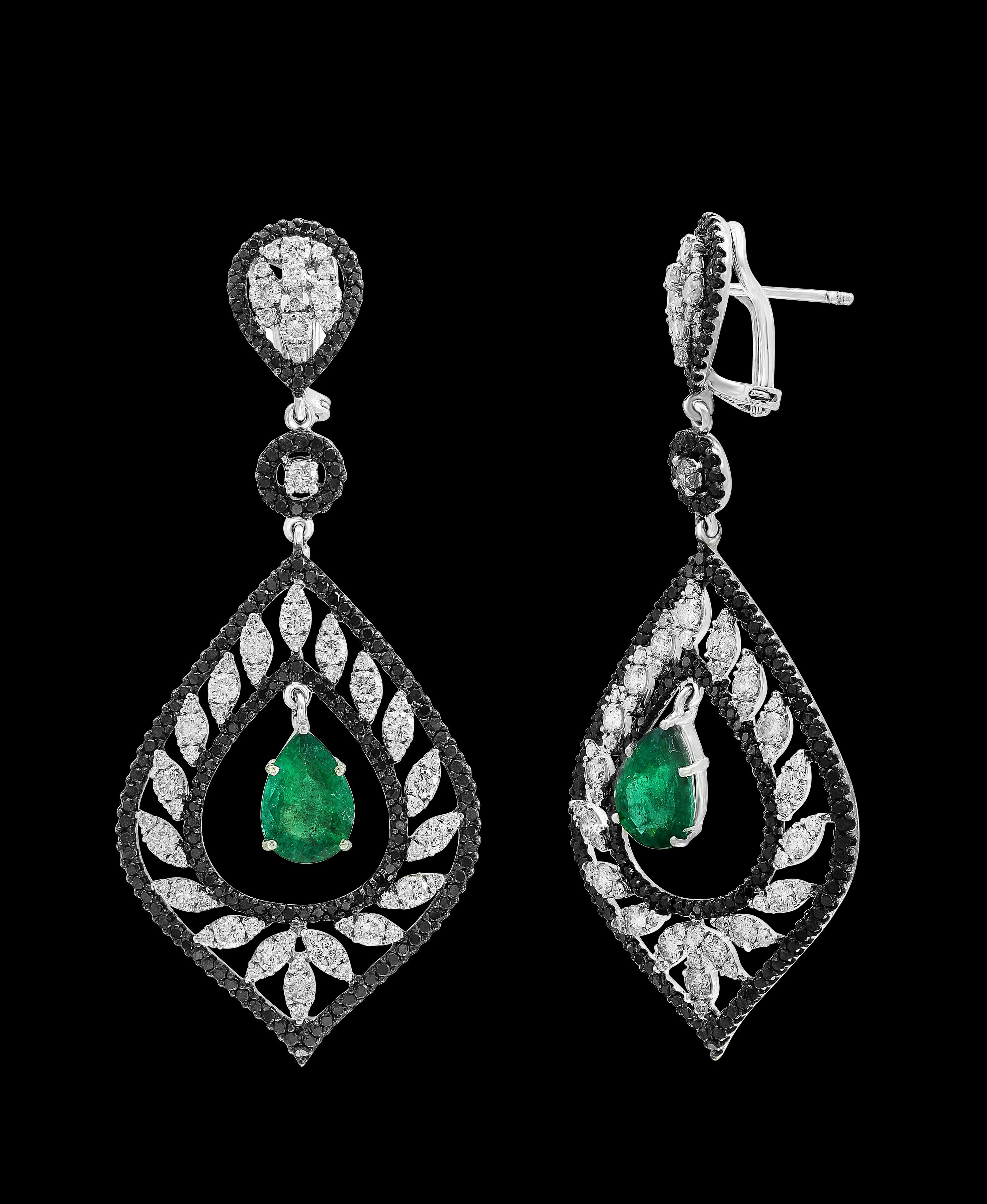 GIA Report # 5222835253
Natural  Beryl 
Origin Zambia
Approximately 6 Carat Certified by GIA Pear Shape Zambian  Emerald Diamond  Hanging Earrings 18 Karat  White Gold
This exquisite pair of earrings are beautifully crafted with 18 karat White gold 