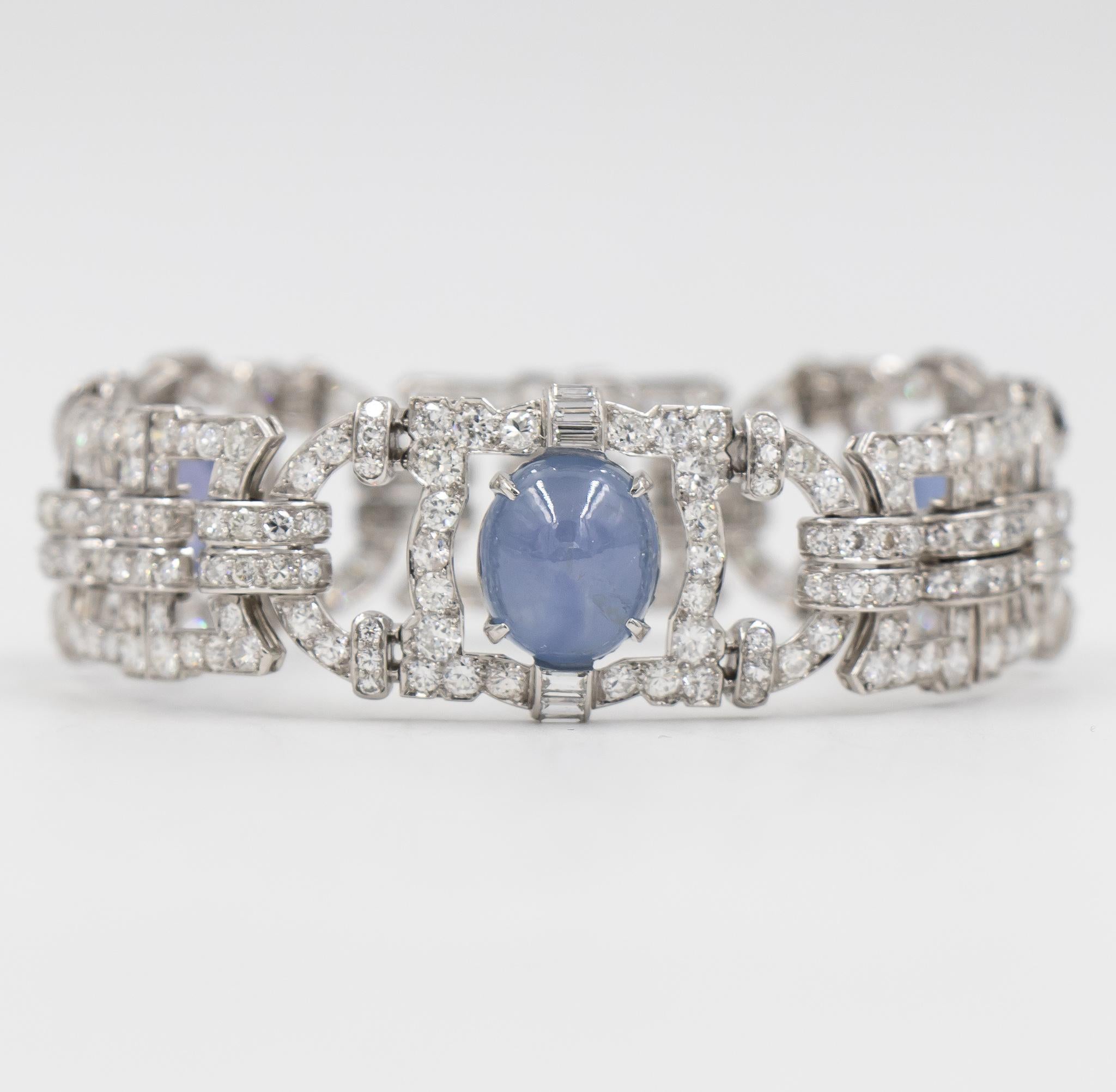 This diamond estate bracelet features three Blue-Gray Star Sapphires set within a bed of high quality diamonds.  The design has three stations with a beautiful art deco pattern.  There is a lovely mix of round brilliant cut & baguette shaped