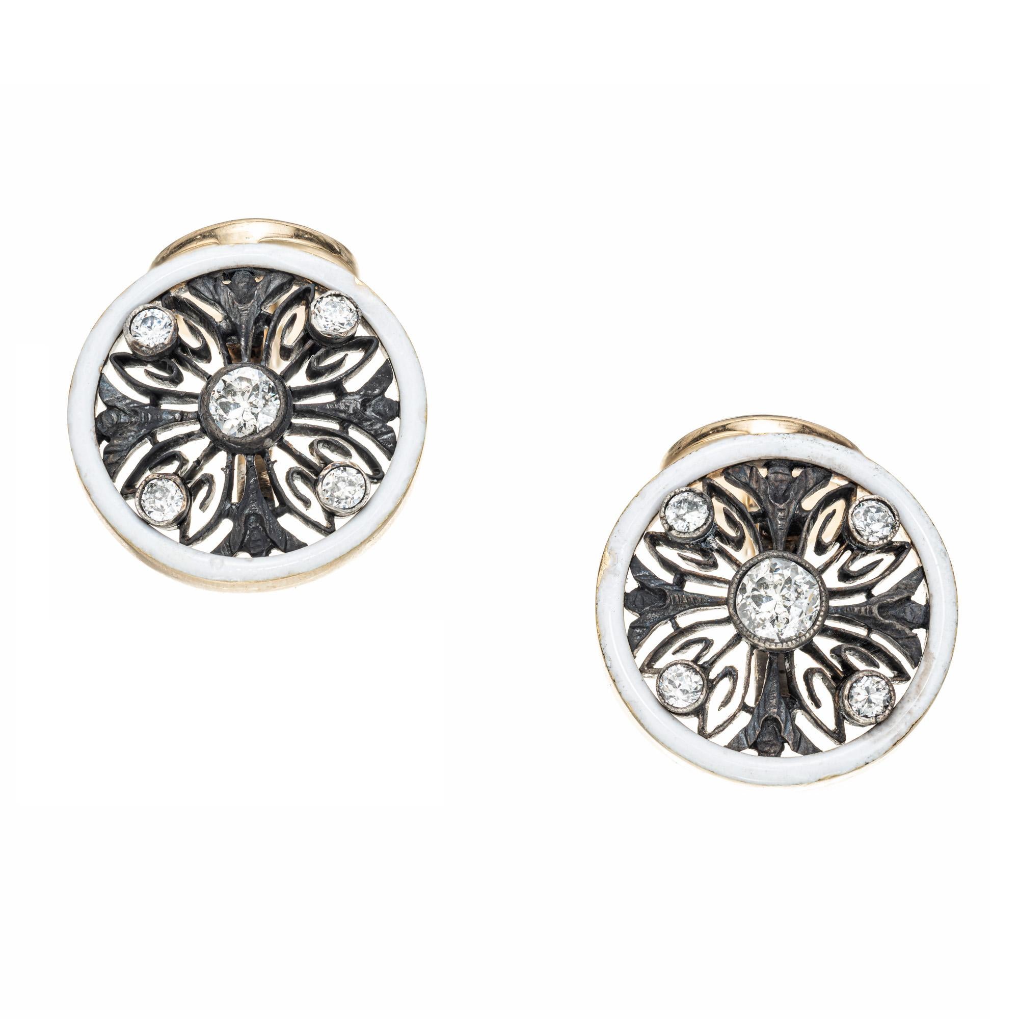 handmade cufflinks. White enamel rim, slight deficiencies, blackened silver and old mine cut diamonds. The round backs are hinged to make them easier to put on. The fronts are silver while the backs are strictly yellow gold.

12 old mine cut