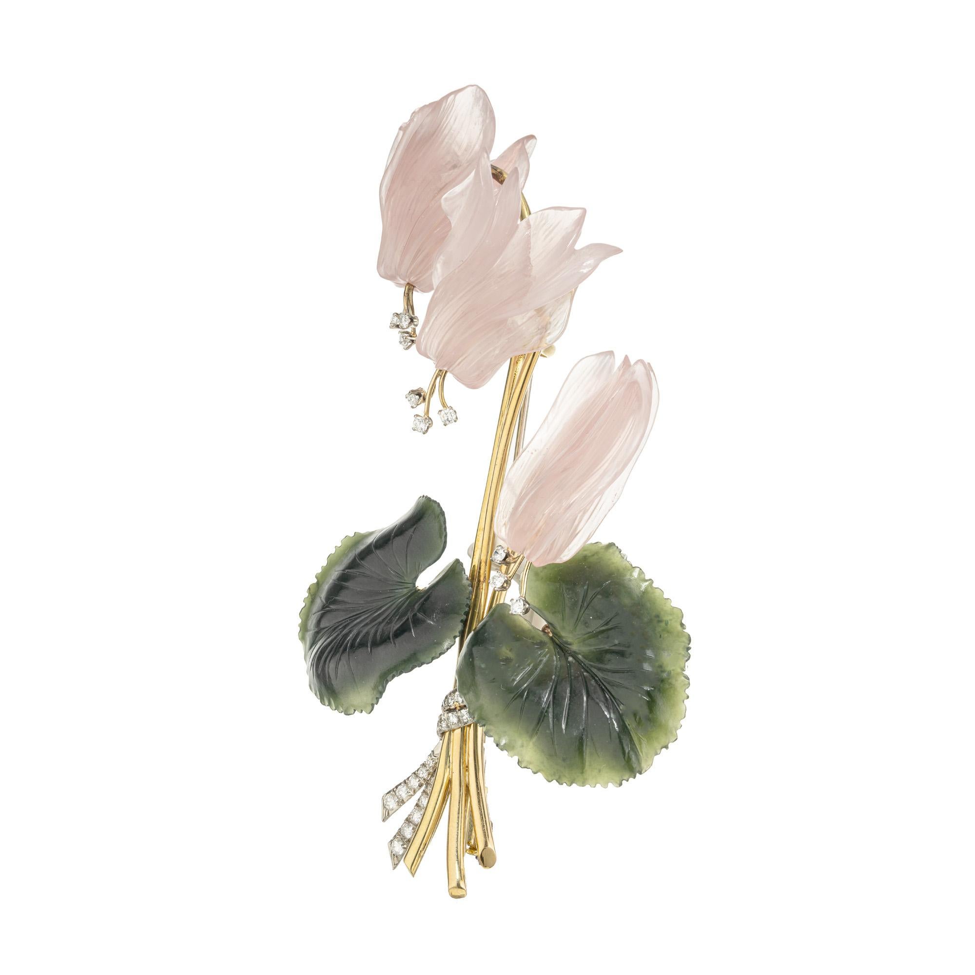 Embrace the timeless elegance of nature's artistry with our Diamond Jade Quartz yellow gold carved flower brooch. This brooch consitst of three Rose quartz pink flowers acccented by round cut diamonds and two carved nephrite jade leafs. Each petal