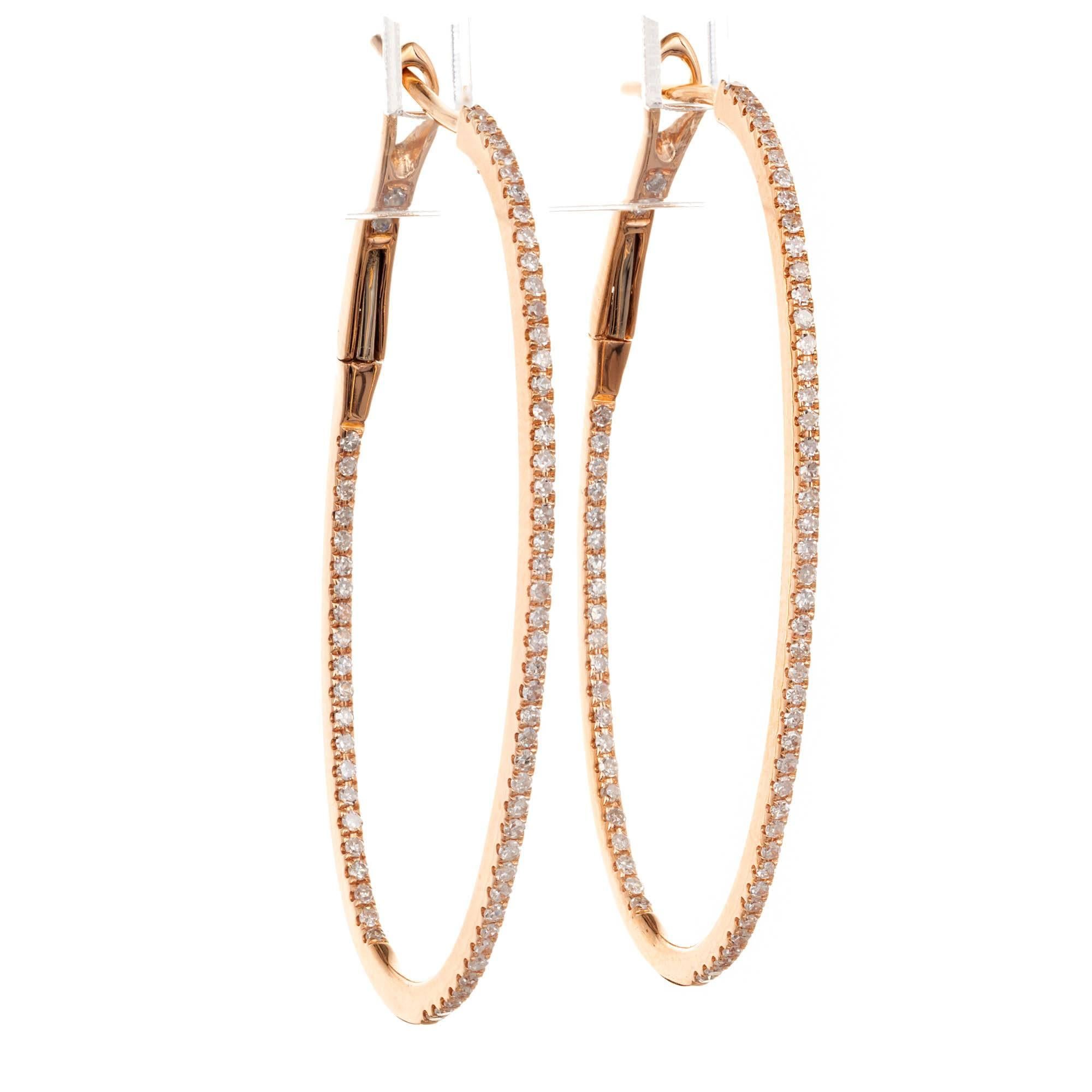 .75 Carat Diamond oval clip post hoop earrings in 8k rose gold. 

138 round diamonds, approx. total weight .75cts, H, VS2 to SI1
18k rose gold
Tested and stamped: 18k
4.4 grams
Top to bottom: 37.28mm or 1.47 inches
Width: 10.5mm or .41 inch
Depth: