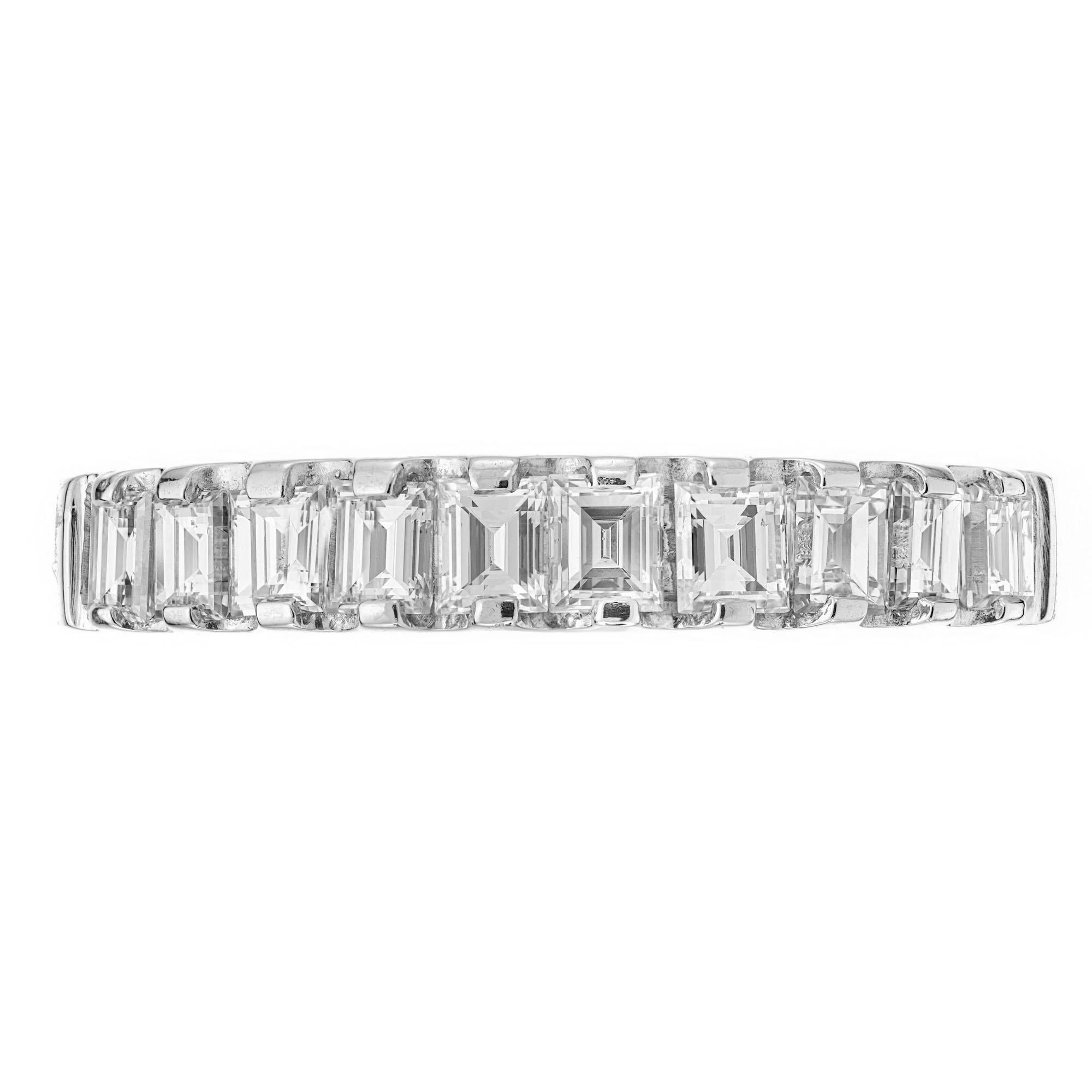 1950's late Art Deco Style 10 square step cut diamond wedding band ring, .75cts. set in platinum.

10 square step cut diamonds, G-H VS approx. .75cts
Size 5.5 and sizable 
Platinum 
4.8 grams
Width at top: 3.5mm
Height at top: 2.7mm
Width at bottom: