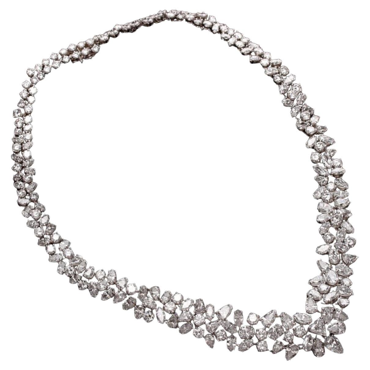 a breathtaking diamond necklace set in platinum, featuring an extraordinary collection of 211 meticulously selected diamonds totaling approximately 75 carats. This luxurious piece showcases a stunning array of heart, pear, round, oval, and