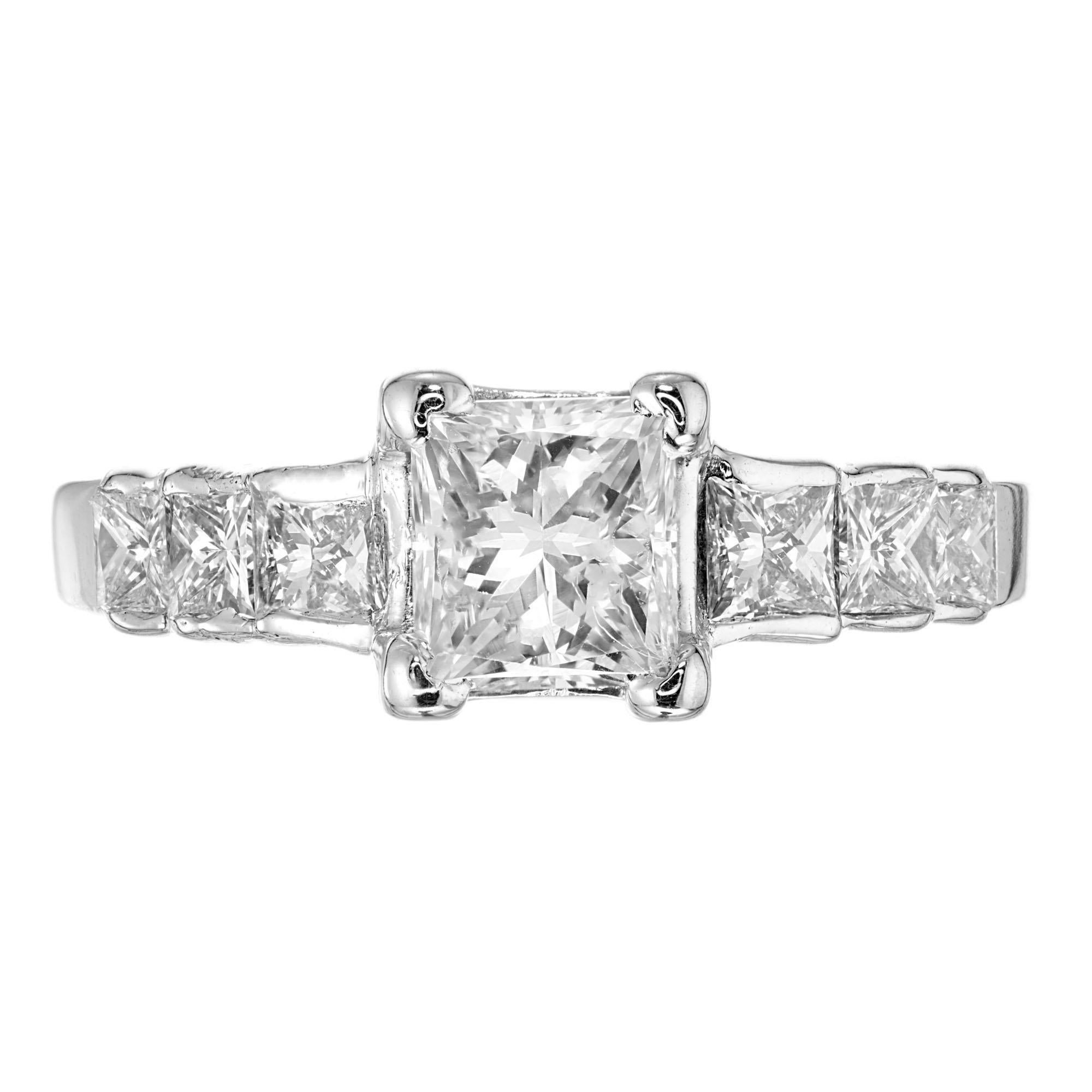 Diamond engagement ring. EGL certified rectangle cut diamond center stone with 6 princess cut graduated accent diamonds in a 14k white gold setting. 

1 rectangular diamond, approx. total weight .75cts, VS2,
6 square Princess cut diamonds, approx.