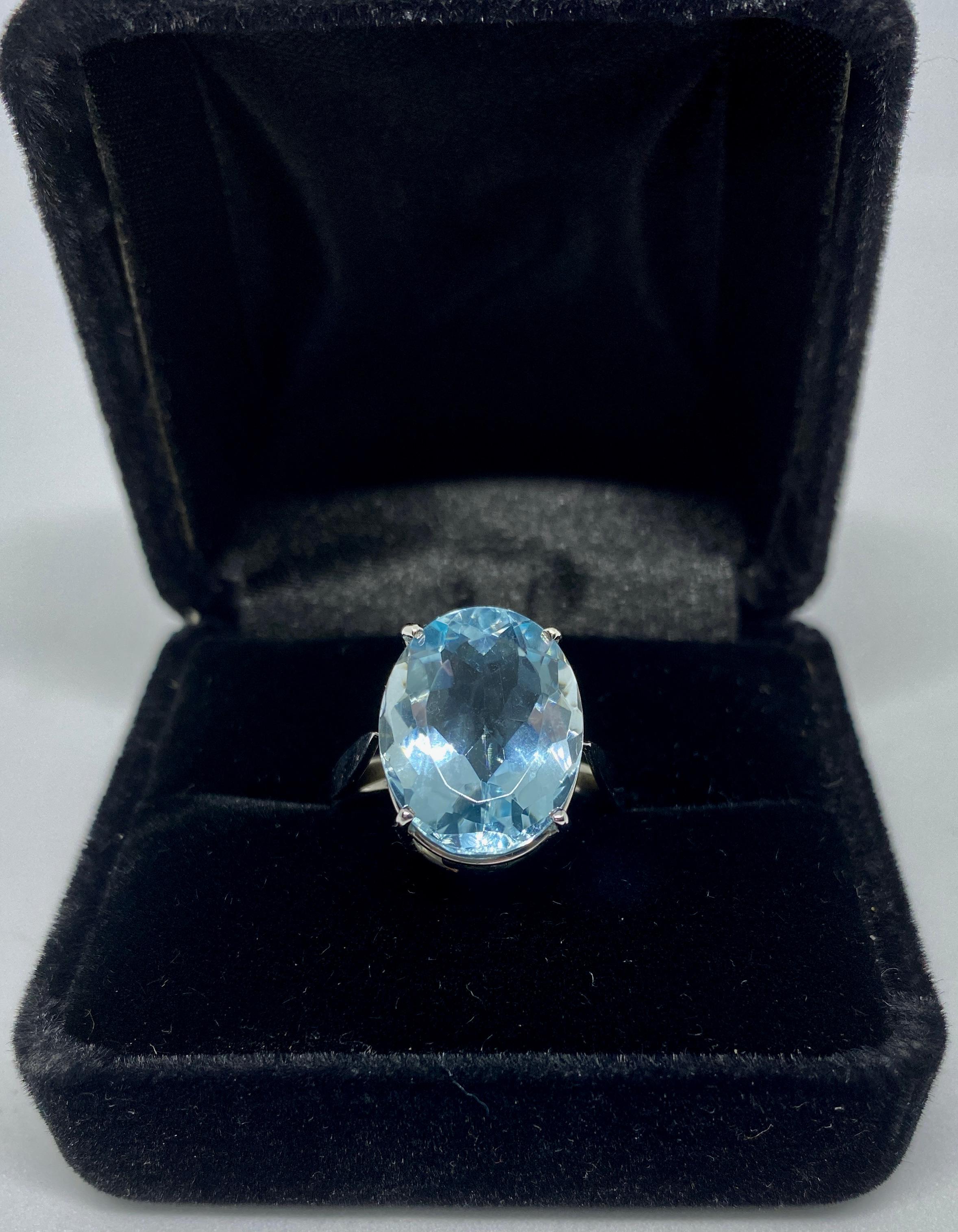 Women's 18 Karat White Gold Ring with Faceted Blue Oval Stone 