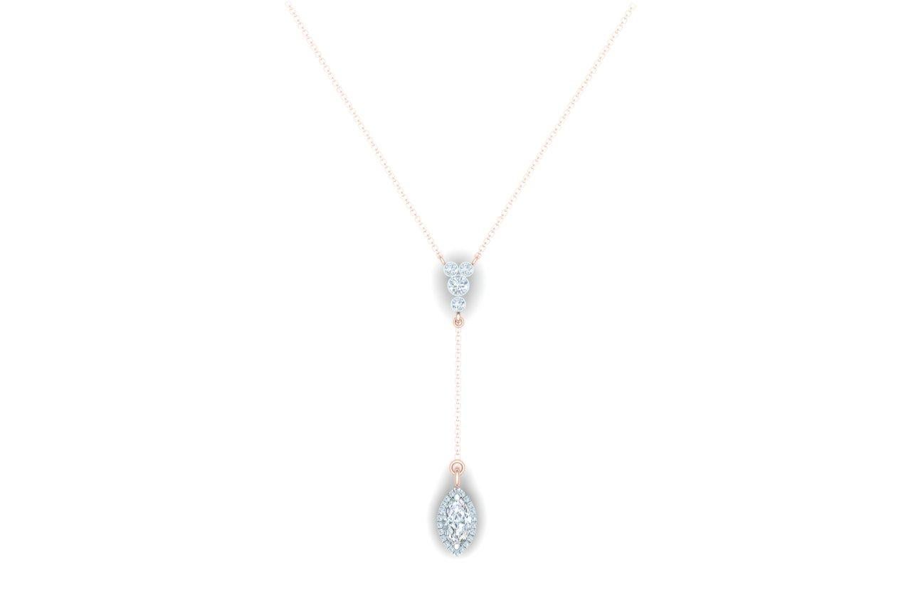 This simple and beautiful diamond necklace is made up of one marquise cut diamond that measures 7 x 4.5 mm and weighs apprx. .50 carats.  The center stone is surrounded by over 16 round brilliant diamonds set in white gold.  The diamonds in this