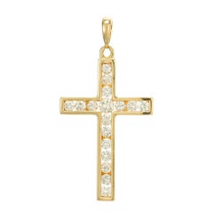 Croix en or jaune avec diamant taille brillant rond de 0,75 carat
