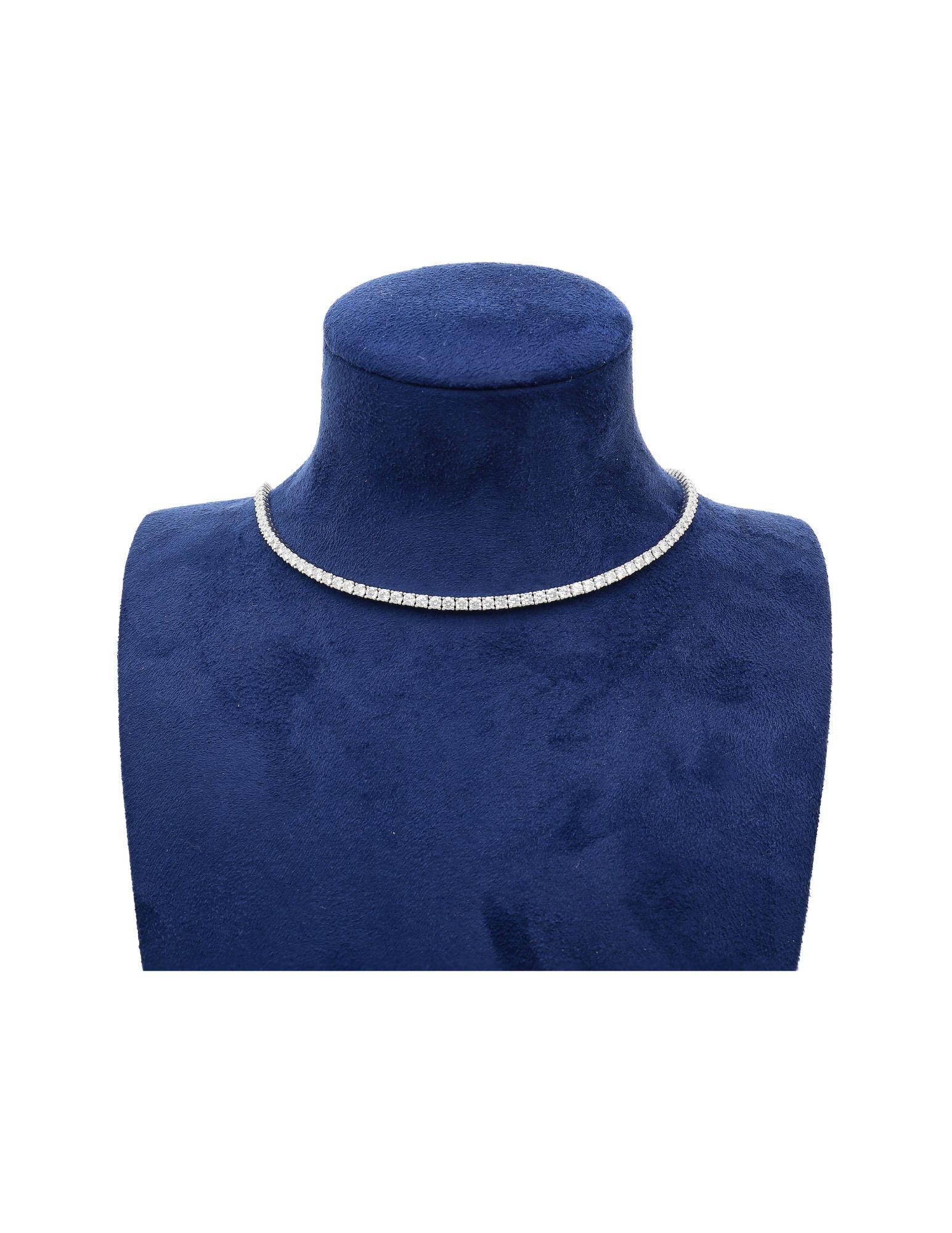 14K white gold natural diamond tennis choker necklace. Set with diamonds on the front and a chain closure on the back. Adjustable choker with a 16-inch length and includes an additional 2 inches to extend if needed.This offers an economical and