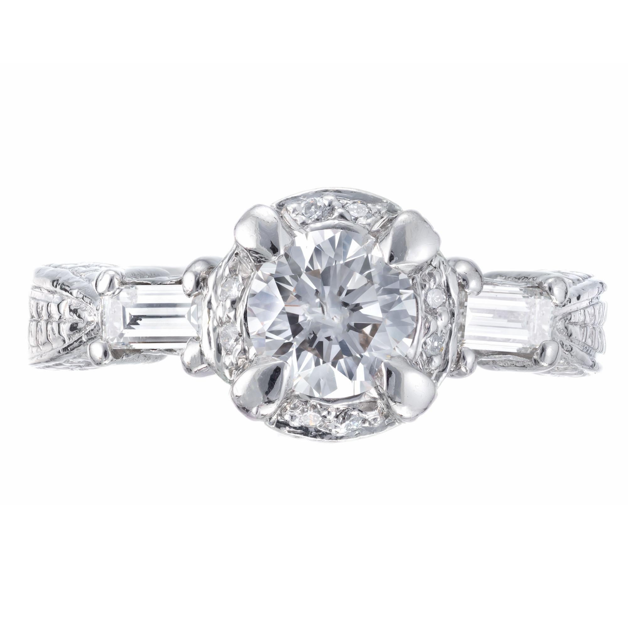 Round and bagguette diamond ring. Round center stone set in platinum with 2 baguette side diamonds and 16 round accent diamonds. 

1 Center diamond approx. total weight .75cts, G, VS2
2 baguette diamonds, approx. total weight .18cts, G, VS
16 round