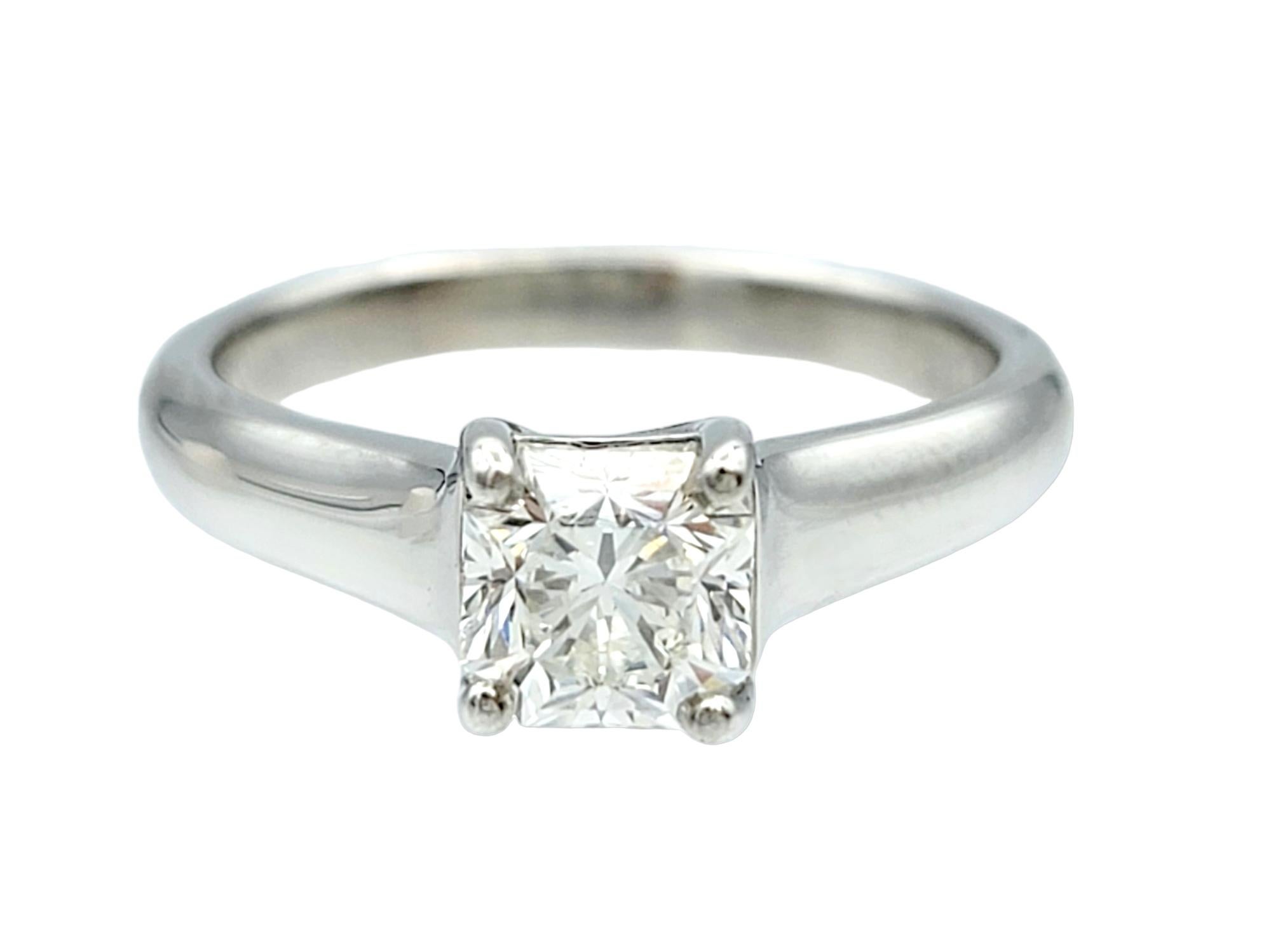 Ring size: 5 

This gorgeous Tiffany & Co. platinum engagement ring is an embodiment of timeless beauty and the promise of a lifetime of love. At its heart lies a magnificent solitaire diamond, cut into Tiffany's exquisite trademark cut, the Lucida