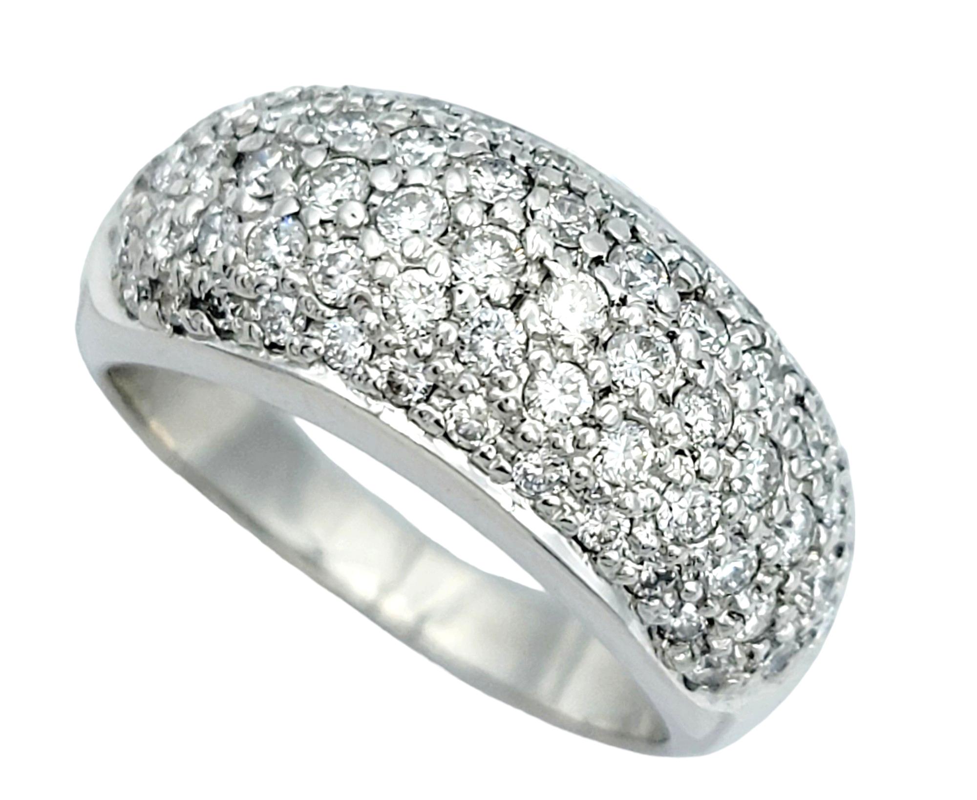 Ring Size: 6.5

This gorgeous ring, set in elegant 14 karat white gold, boasts a chic and timeless design. The dome shape adds a sense of volume and prominence to the piece, creating a stylish and eye-catching silhouette. The entire top surface of