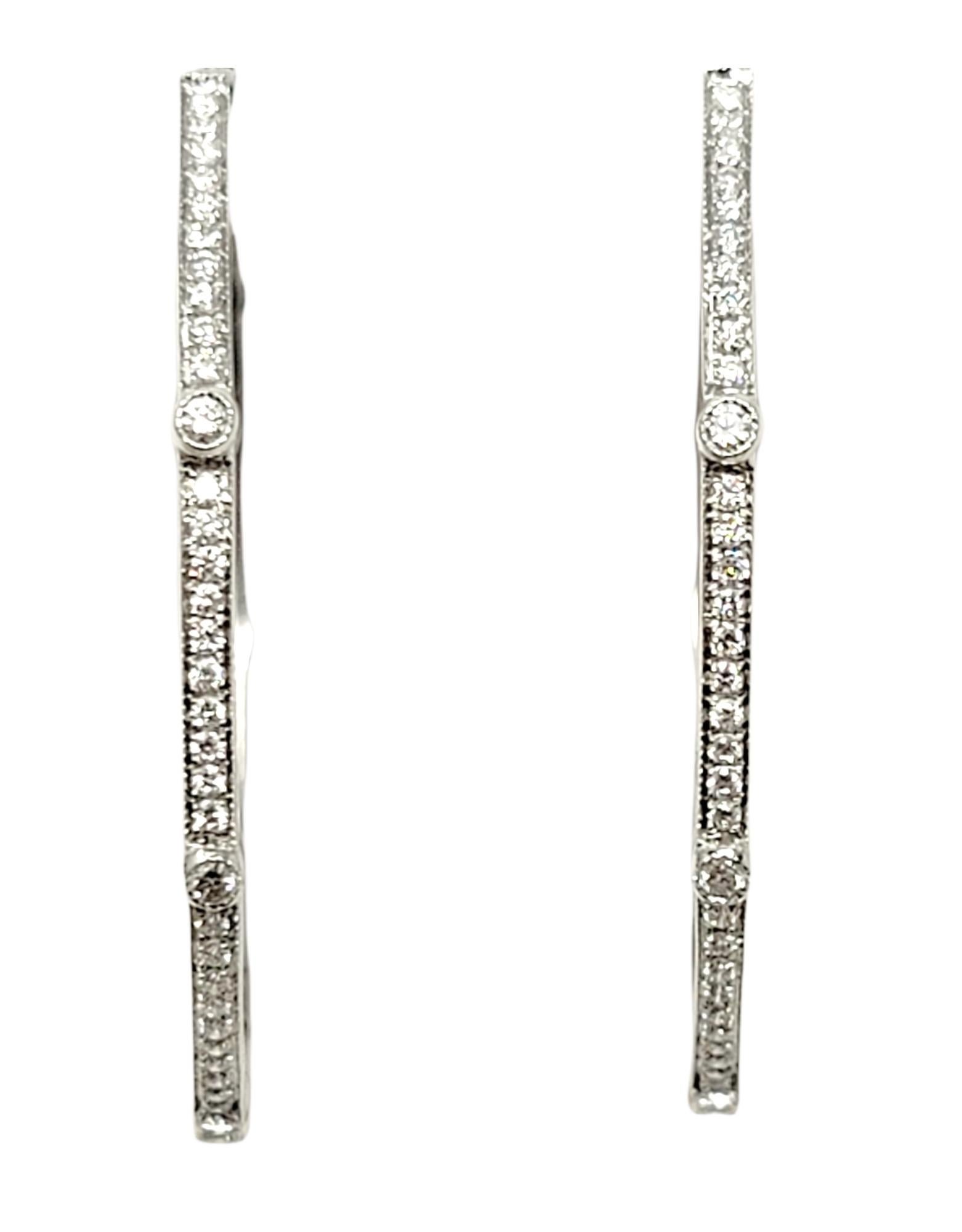 Chic, modern white gold and diamond hoop earrings are an absolute must for your jewelry wardrobe! Dress them up or down, take them from the office to date night, these timeless earrings are the perfect pair.

Earring style: Hoop
Metal: 18K White