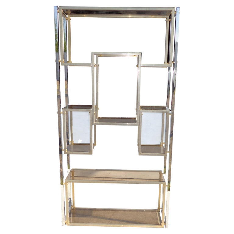75? Chrome Milo Baughman Style Etagere 

Stylish multi-shelved unit in chrome with brass accents and smoked glass.