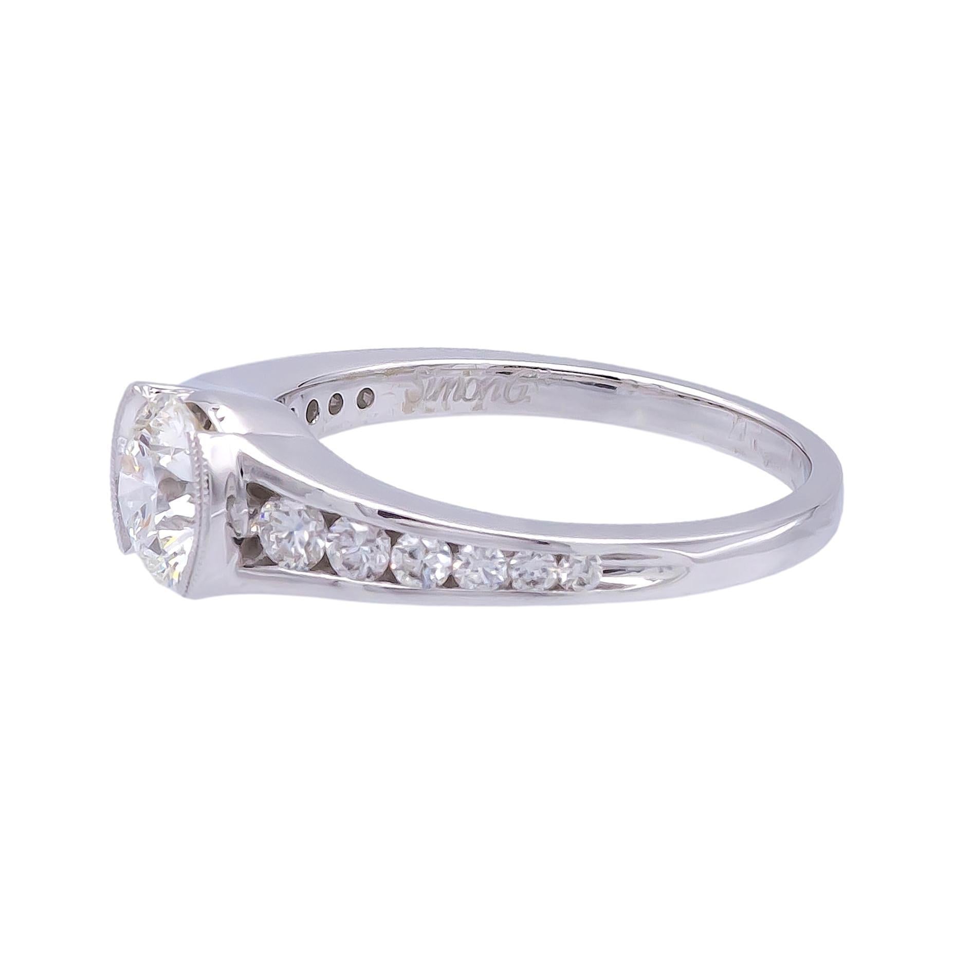 Engagement ring with a Round Brilliant 0.75 ct center H color VS1 clarity diamond, Excellent cut and brilliance certified by GIA (Gemological Institute of America) finely crafted and set in a Millgrain Half Bezel 18 Karat white gold mounting with 10