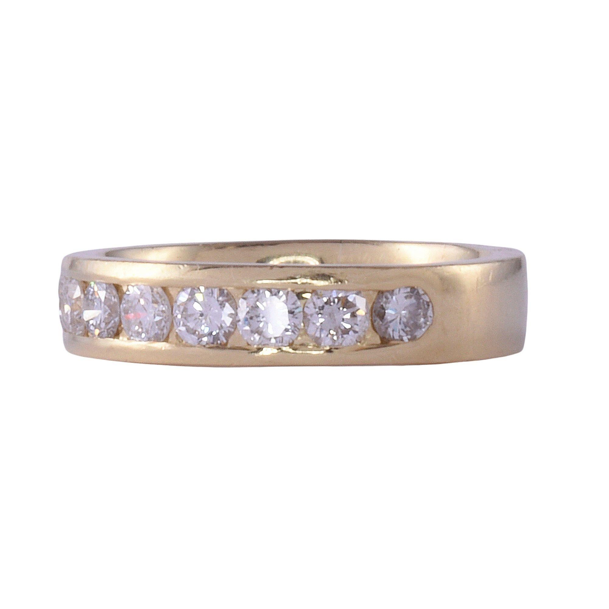 Estate .75 CTW diamond 18K gold band. This band style ring is crafted in 18 karat yellow gold and features a channel of diamonds at .75 carat total weight. The diamonds have VS2-SI2 clarity and G-I color. This diamond band is a size 6+. [KIMH 599]