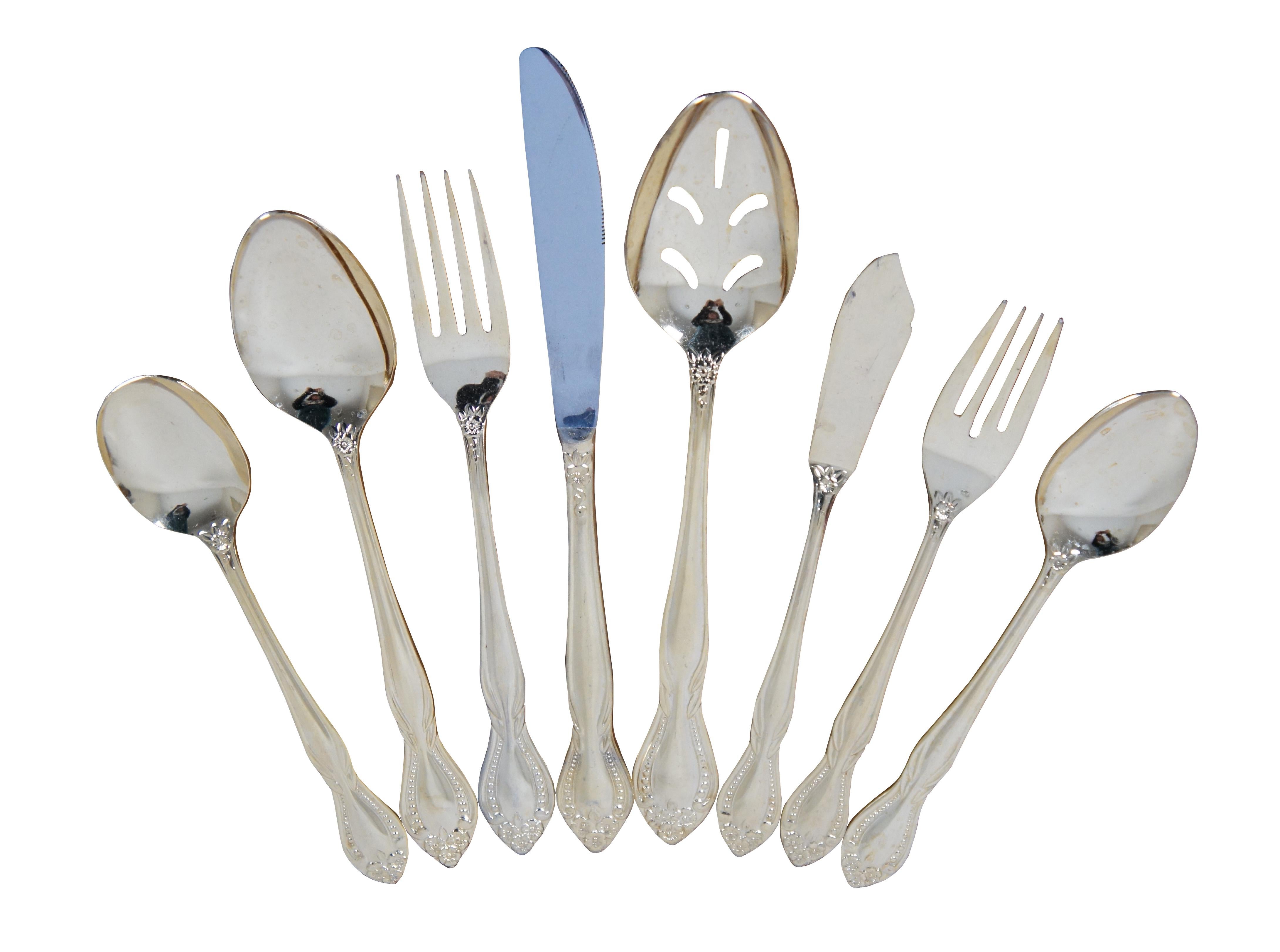 Vintage 75 piece set, service for 12 people, flatware by Supreme Vermai - 23 karat gold plating over stainless, heavy gauge tableware in the Raquel beaded and floral pattern. Made in Japan.

Measures: 12 Table Knives - 8.5” x 0.75” / 12 Dinner