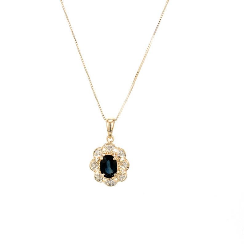 1970's Sapphire and diamond pendant necklace. 1 oval sapphire set in a 14k yellow gold setting with a halo of 8 single cut diamonds. 18 inch 14k yellow gold chain. 

1 oval blue sapphire, approx. .75cts
8 single cut diamonds, H I approx. .4cts
14k