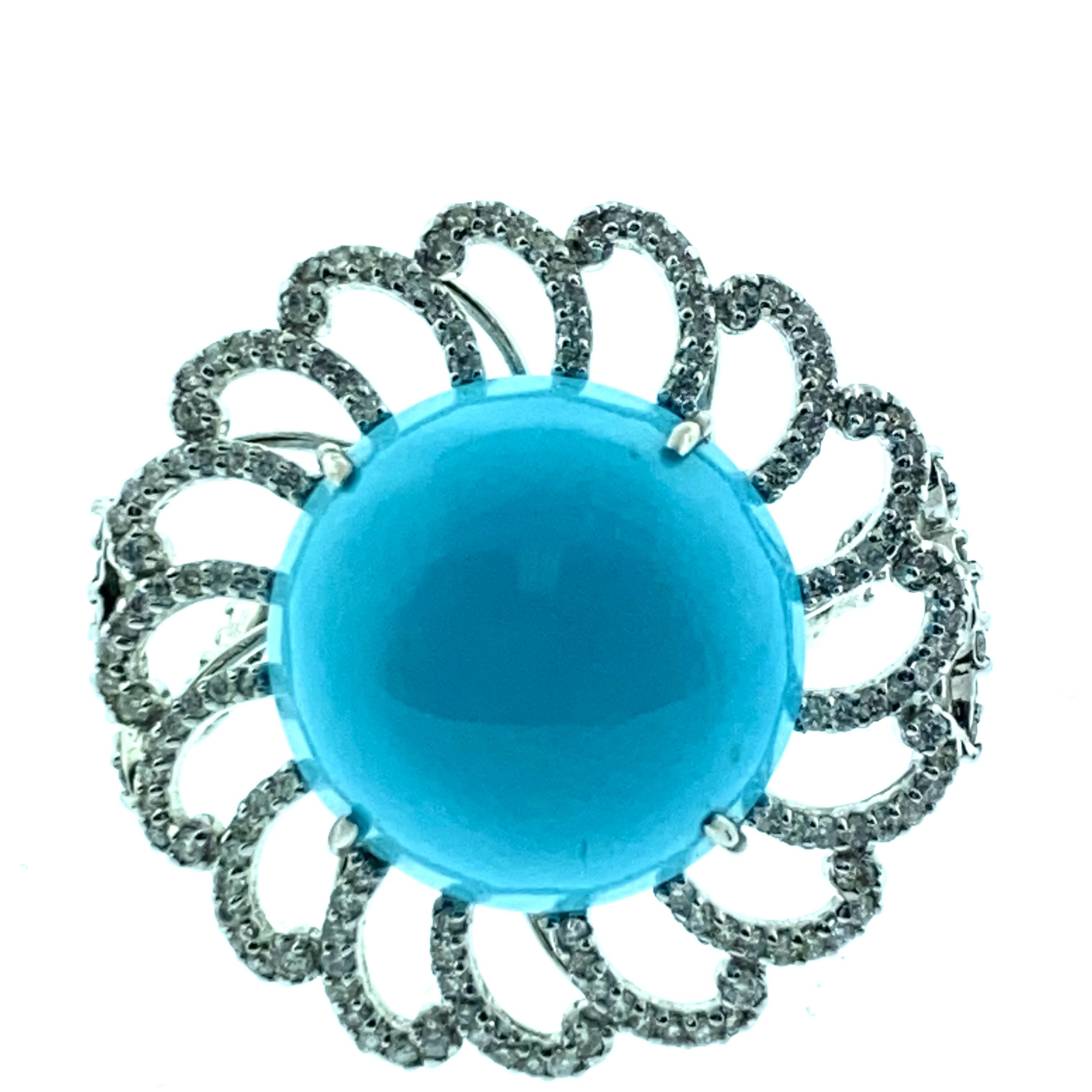 7.5 Size 22.56 ct Turquoise , 1.12 ct Diamond Ring set in 18K White Gold in a flower shape. This ring has a round cabochon turquoise which is prong set in 18K White Gold. The ring shank can be sized to any size. 
Stones : Turquoise - 22.56 ct
      