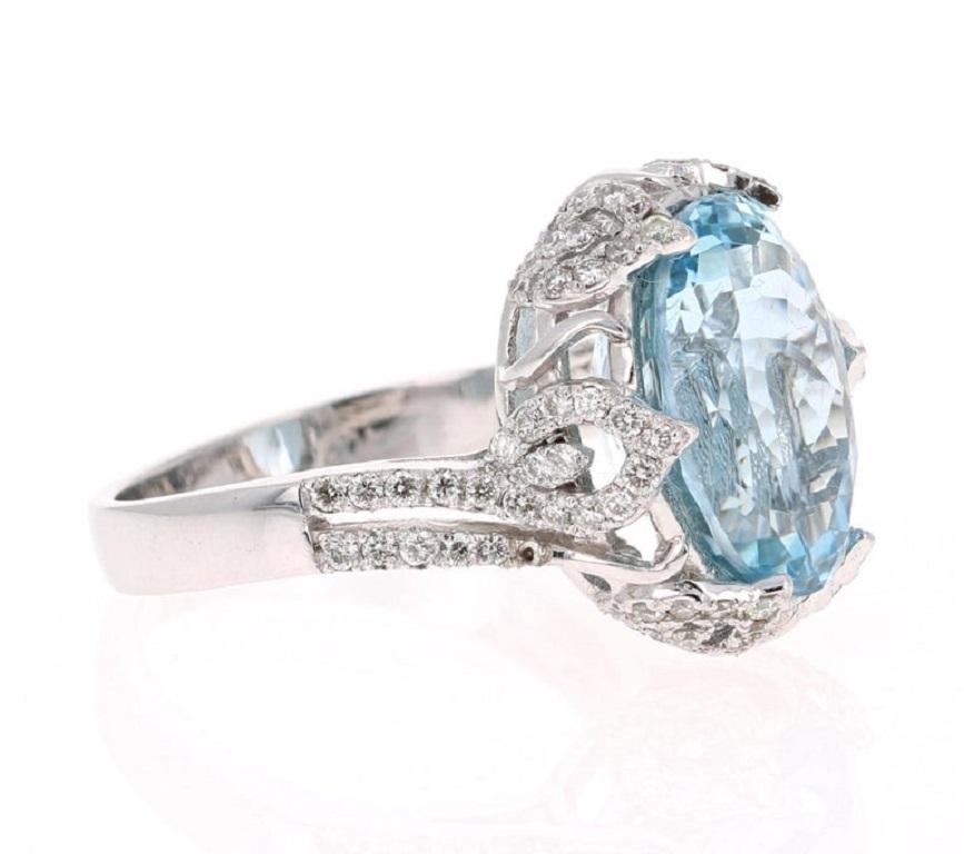 This ring has a gorgeous 6.85 Carat Oval Cut Aquamarine and is surrounded by Natural Round Brilliant Cut Diamonds that weigh 0.65 Carats. The Total Carat Weight of the ring is 7.50 Carats. The Clarity & Color of the diamonds are VS-H. The Aquamarine
