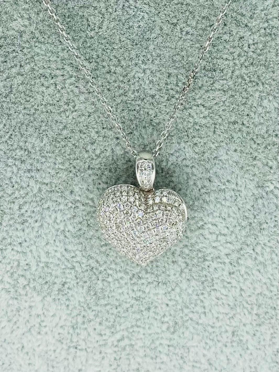 7.50 Carat Diamonds 3D Heart Love Pendant Necklace
The pendant is made in 18k solid white gold and features approx 7.50 carat of high clarity white color diamonds. The pendant measures 24mm X 18mm and weights 7.6 grams gold. The necklace that’s