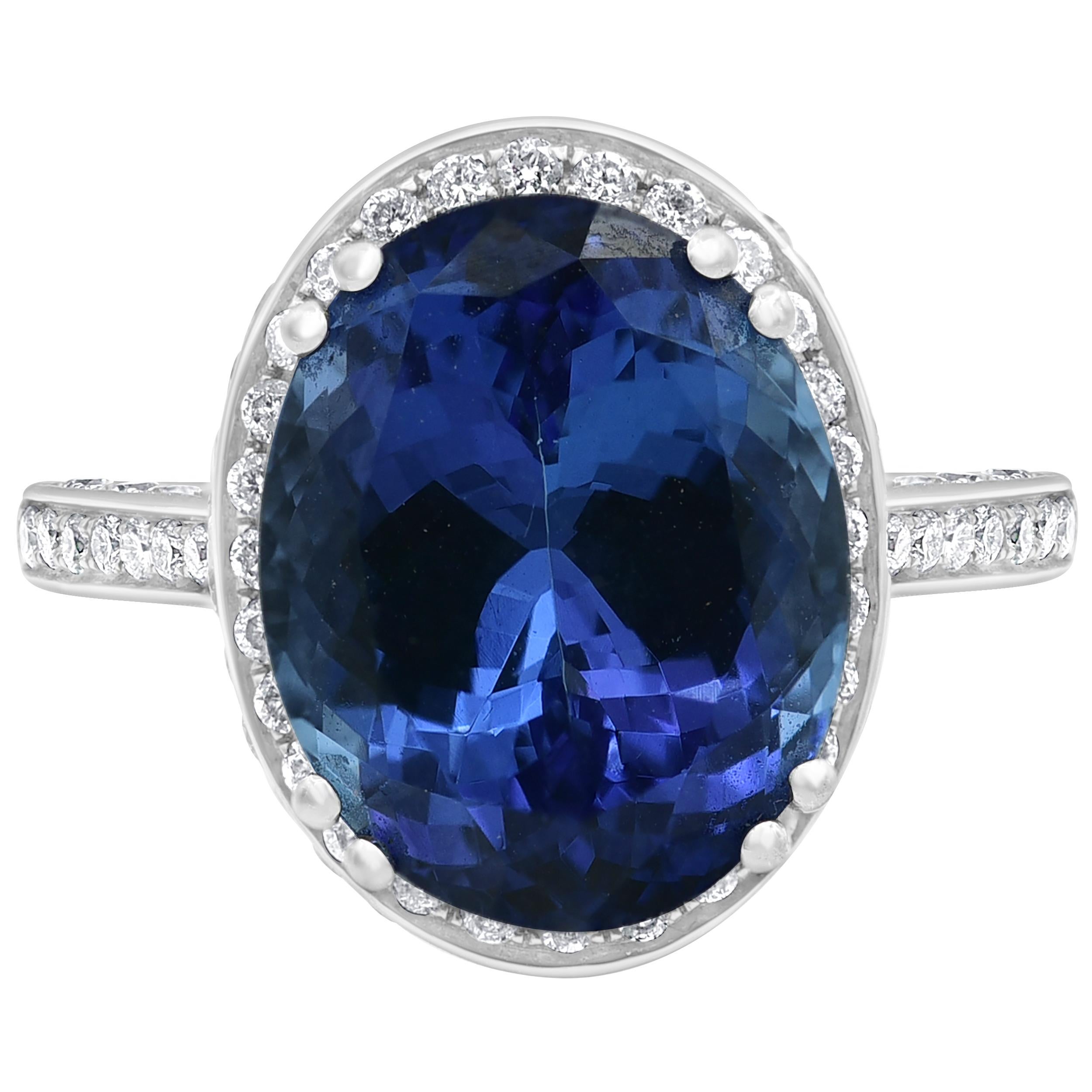 So intriguing, this 7.50 CTW Tanzanite gemstone and 0.90 CTW diamond ring create a sensation. Crafted in cool 18K white gold, this stunning style features oval-shaped violet-blue Tanzanite wrapped in a halo frame of shimmering diamonds.