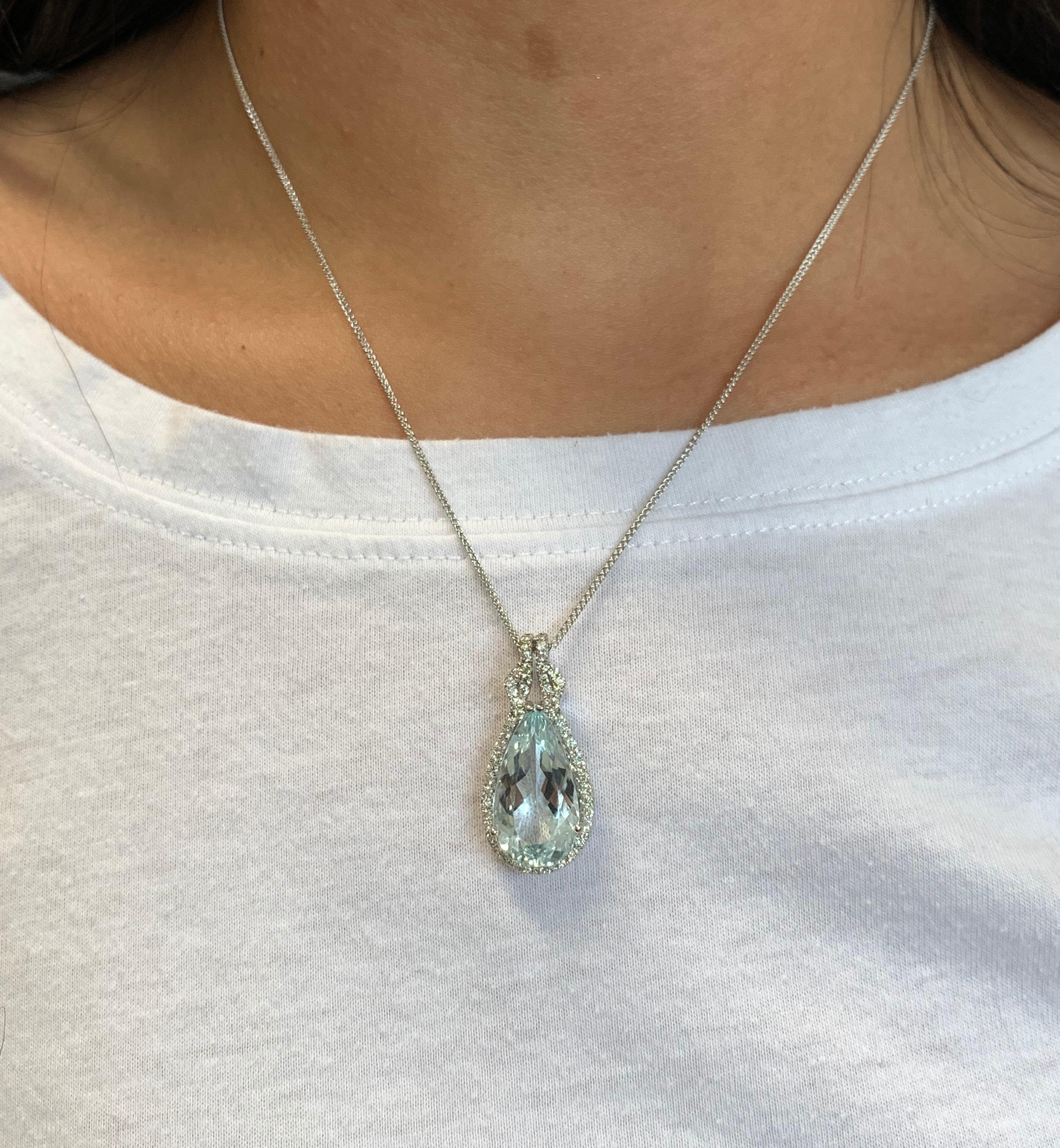 Material: 14k White Gold 
Center Stone Details: 1 Pear Shaped Aquamarine at 7.50 Carats - Measuring 11 x 20 mm
Diamond Details:  Round Brilliant Diamonds at 0.56 Carats.  SI Quality /  H-I Color
Chain Length:  17 Inch

Fine one-of-a-kind