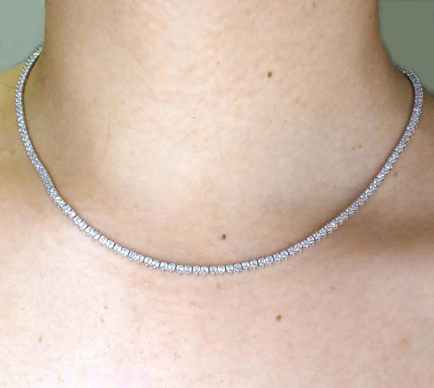 An Amazing Estate Diamond Handmade 14k White gold (stamped) Tennis Necklace with over 184 Round Brilliant Diamonds in G color, VS-SI clarity over all, Gemologic Certified. Estimated total weight of the diamonds is 7.50ctw.
The length of the necklace
