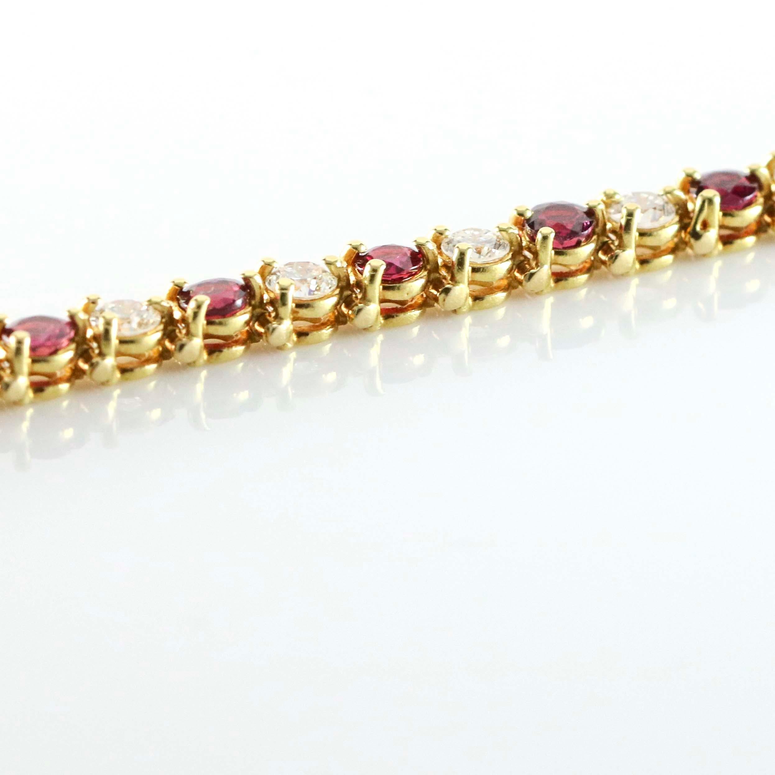 Alternating ruby and diamond tennis bracelet crafted in 18 karat yellow gold. The bracelet is prong set with 17 round cut natural rubies, and 17 round diamonds. Ruby total carat weight, 4 carats. Diamond total carat weight, 3.5 carats. Size medium.