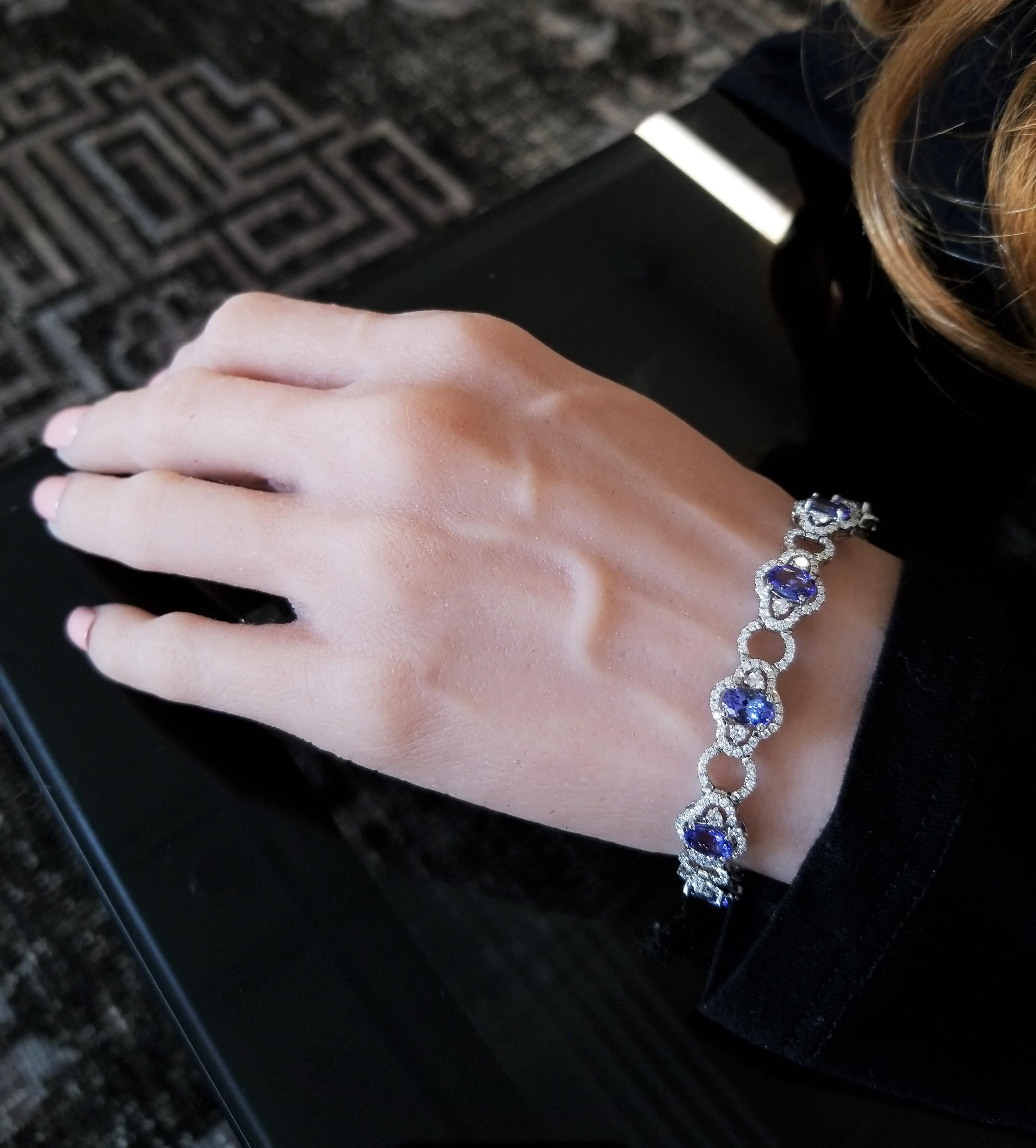 This decorative Art Deco style bracelet has 10 oval cut tanzanites, measuring 7X5mm, totaling 7.50 carats standing in a north-south orientation. The gem source is near the foothills of Mt. Kilimanjaro in Tanzania; the suite is perfectly matched in