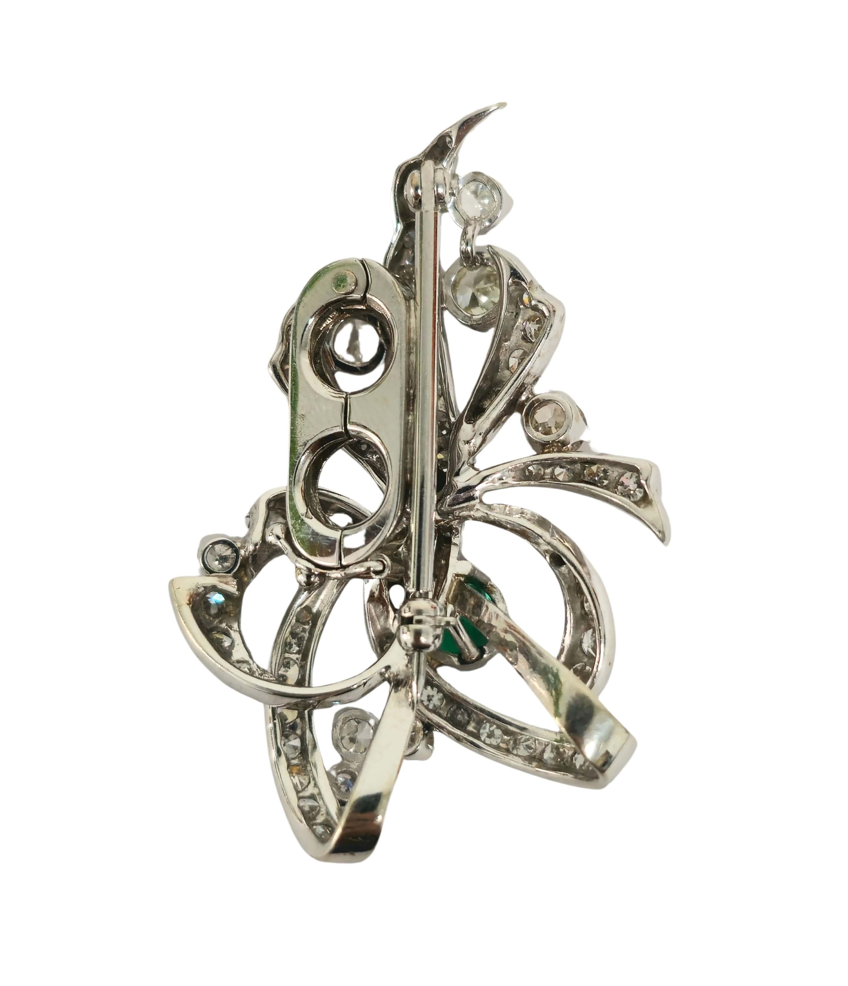 Exquisite in its elegance, this 14K white gold ring features a remarkable 2-carat emerald cut Colombian emerald, showcasing its vivid green hue and intense fire. Surrounding the emerald are dazzling round brilliant cut diamonds totaling 5.5 carats,